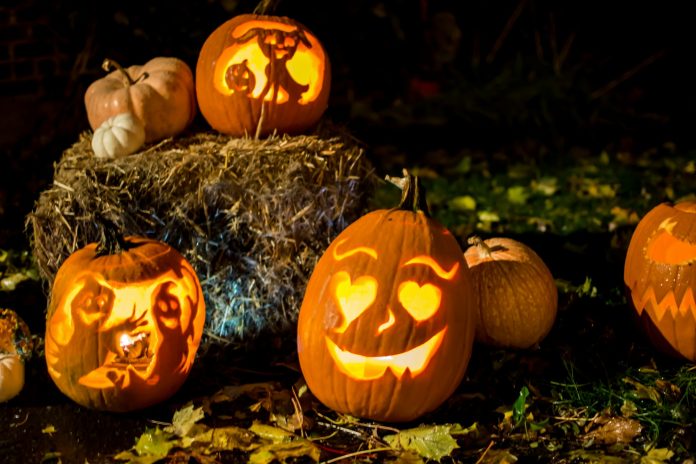 Halloween night Happy smiling pumpkin jack o’lantern outdoors