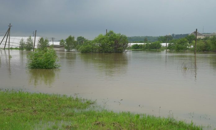 Aerial of extreme flooding on flooded farm field after heavy rain.