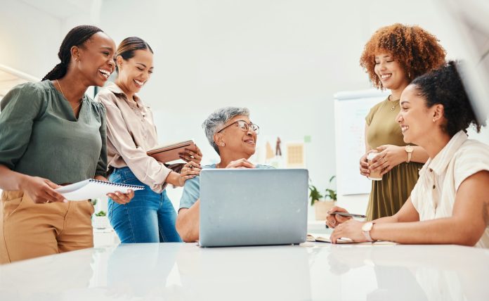 Laughing, meeting and women in fashion with a laptop for advice, communication or styling training.