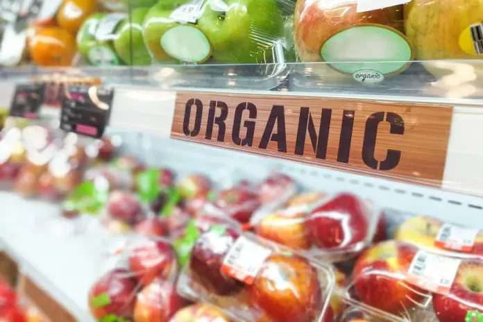 Organic food signage on modern supermarket fresh produce fruits