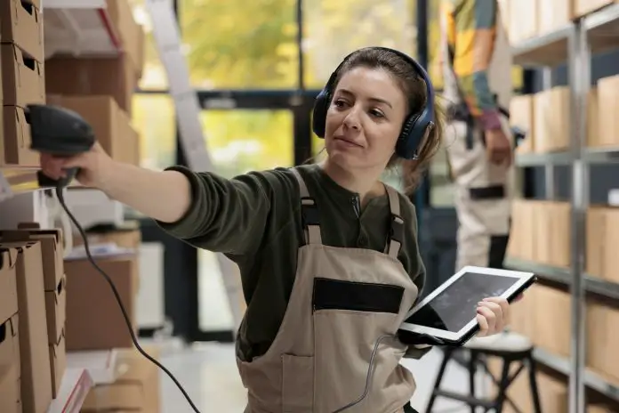 Supervisor wearing headset listening music during inventory