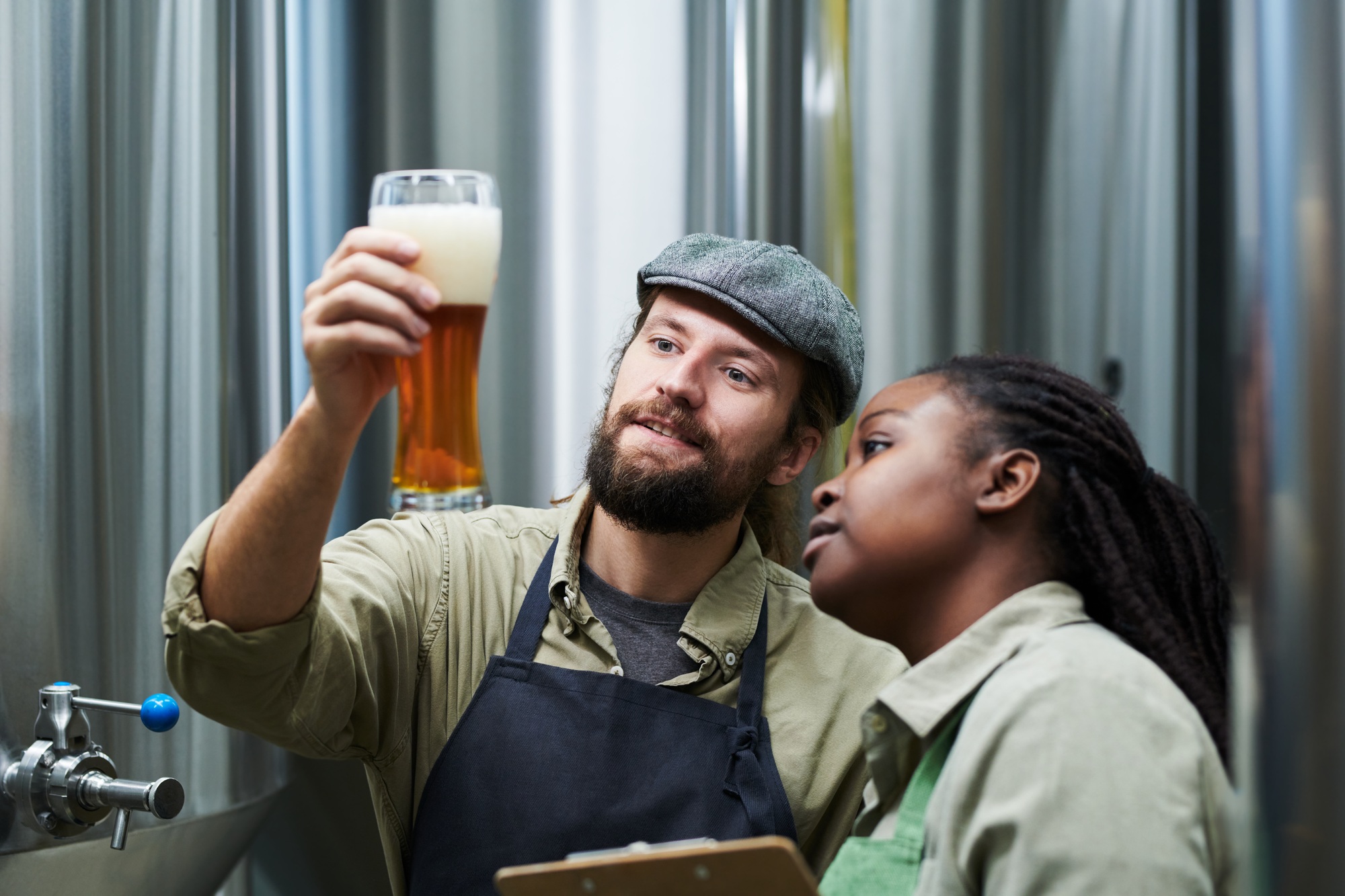 Brewery Workers Checking Beer Froth