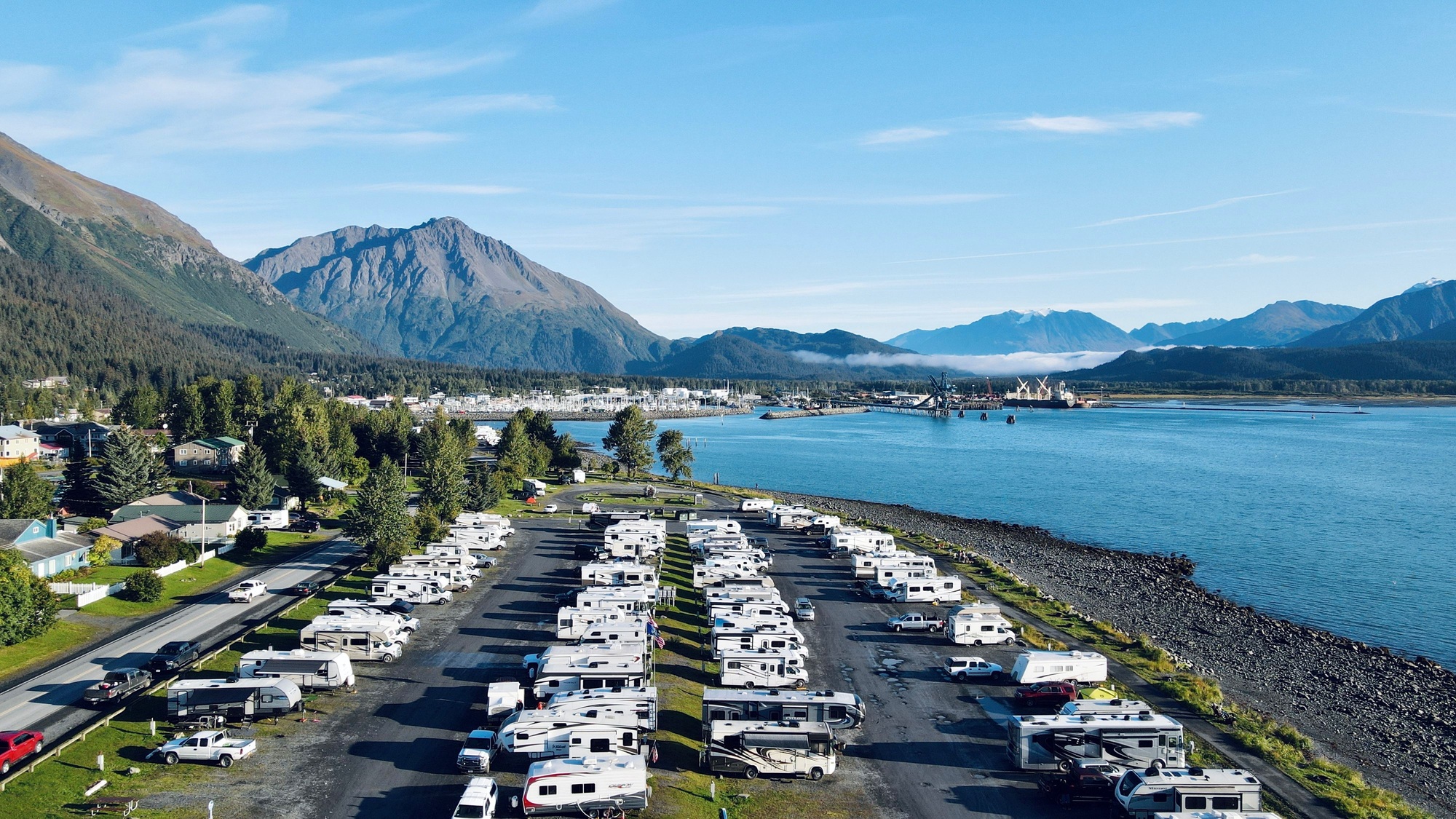 Recreational vehicle park in Alaska with beautiful mountains in the background.