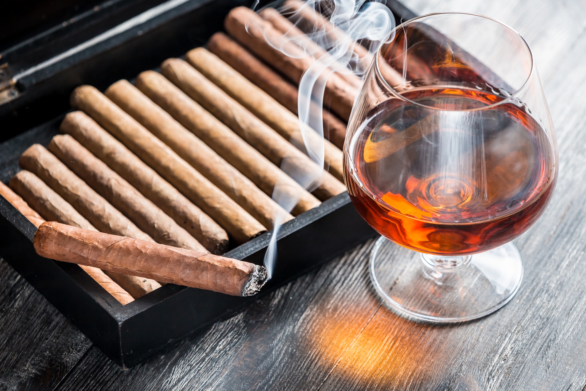 Aroma of cognac and smoking a cigar