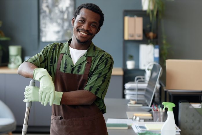 Black Man in Cleaning Service in Uniform Standing and