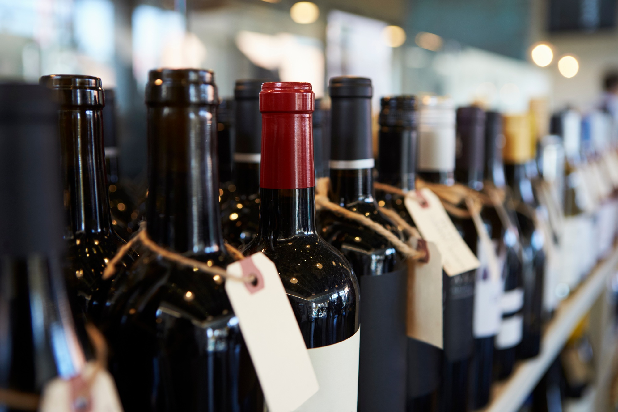 Bottles Of Wine On Display In Delicatessen