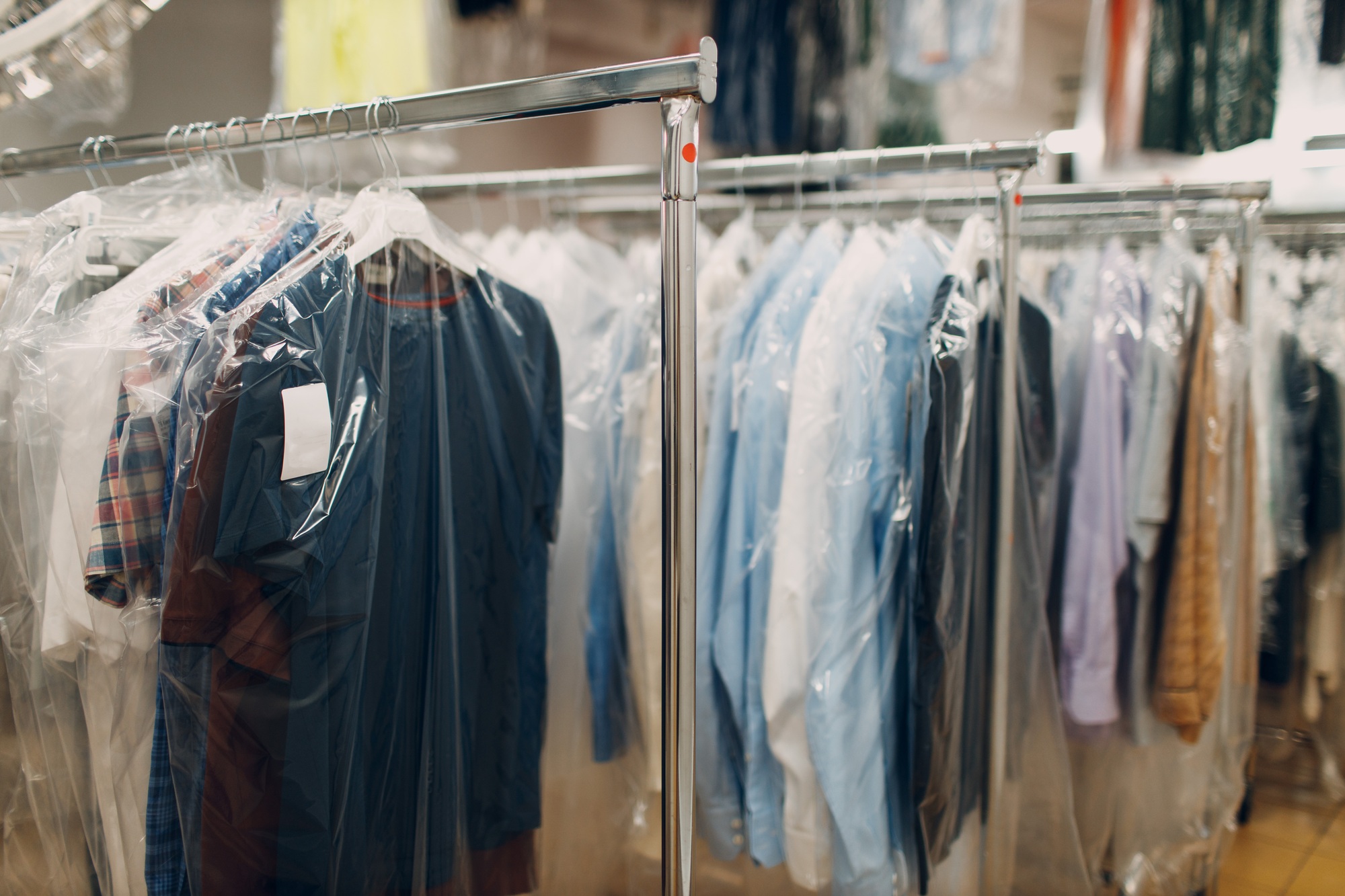 Dry cleaning clothes. Clean cloth chemical process. Laundry industrial dry-cleaning