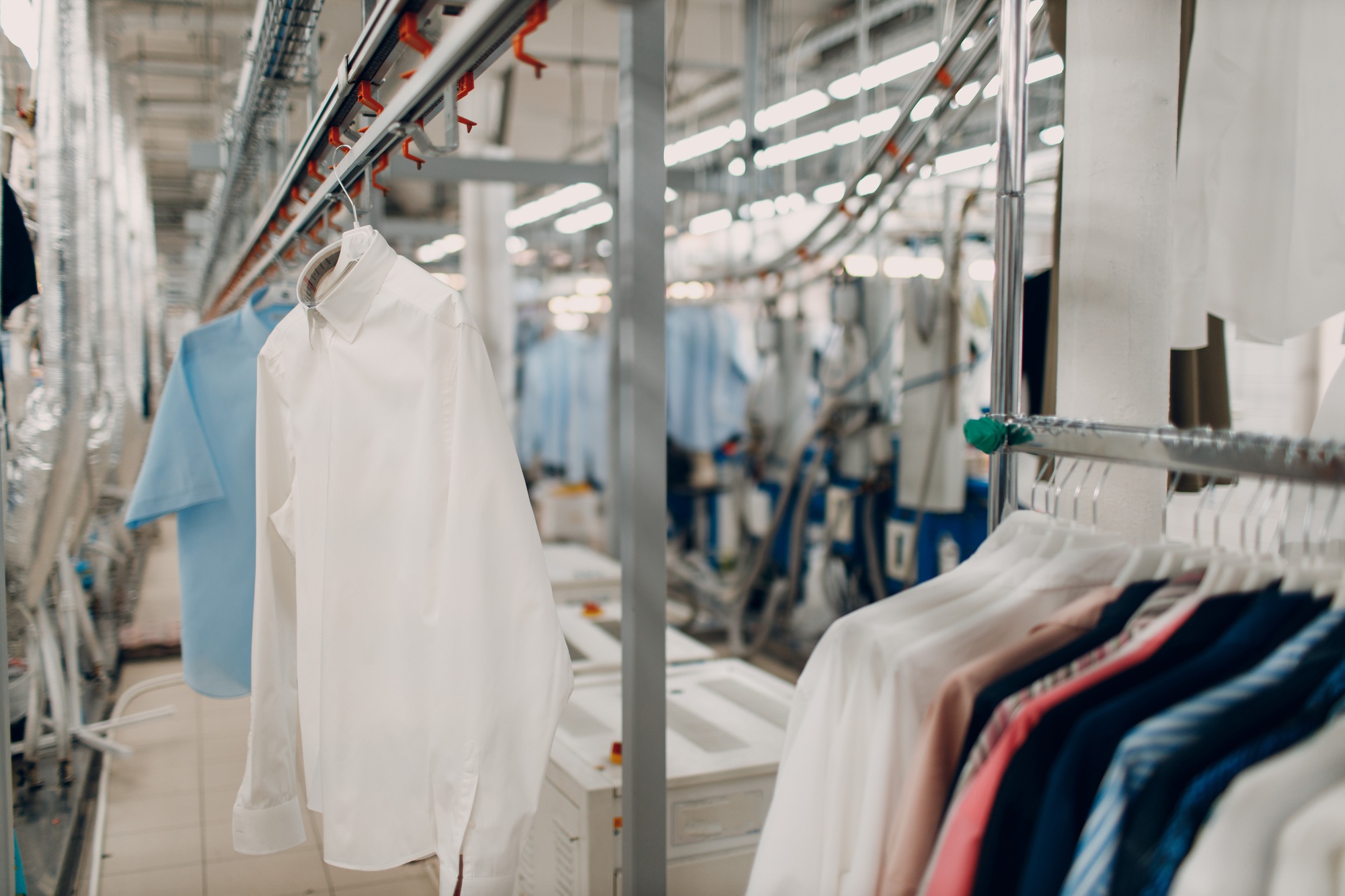 Dry cleaning clothes. Clean cloth chemical process. Laundry industrial dry-cleaning