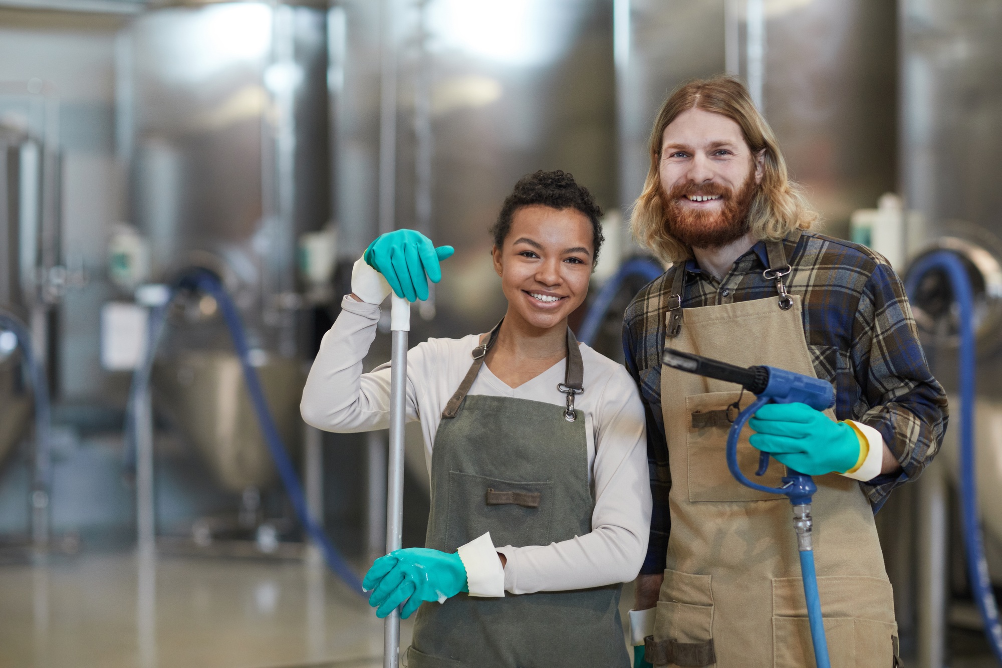 Two Cleaning Workers Smiling at Camera