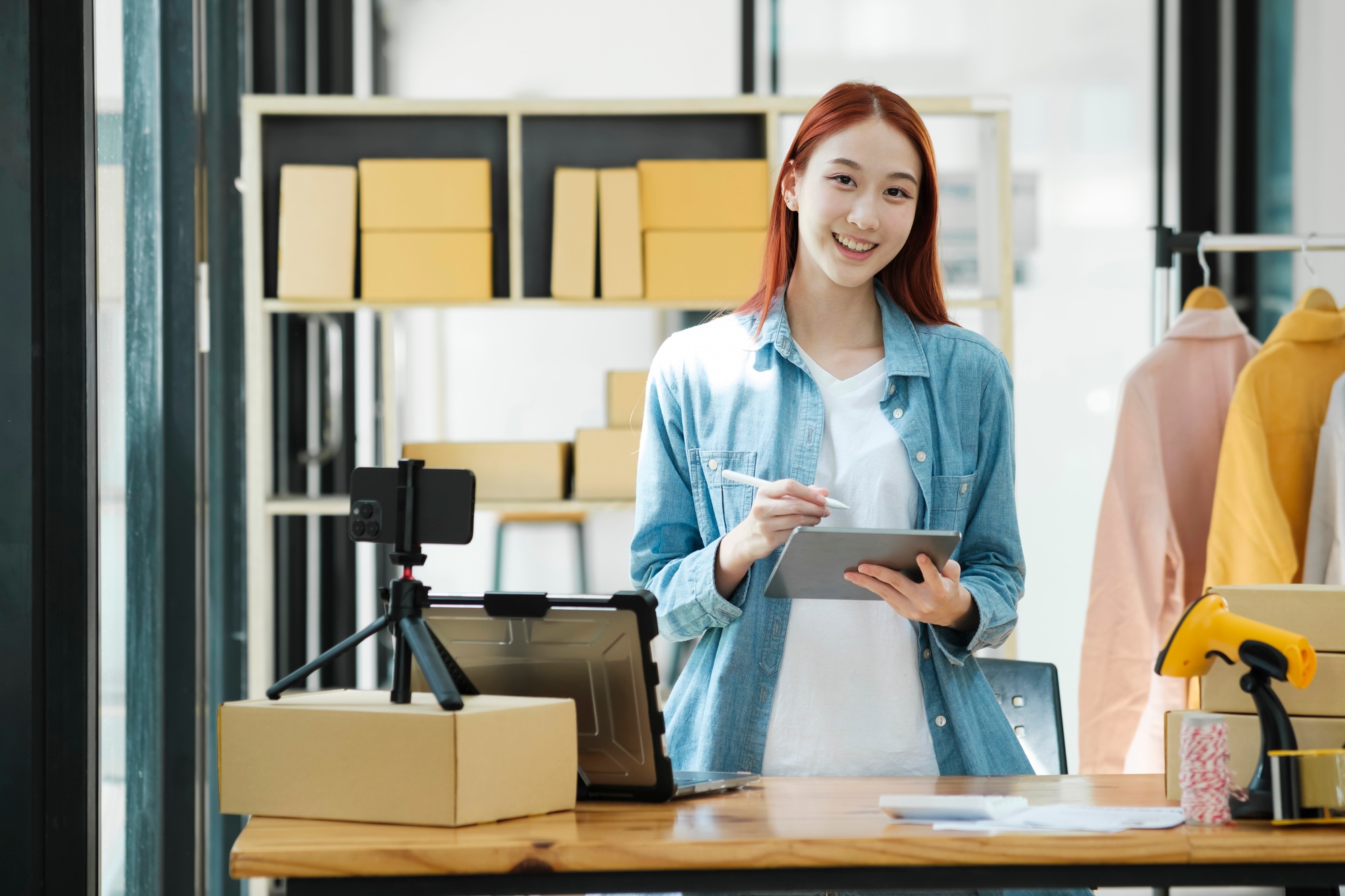 Confident woman portrait entrepreneur at ecommerce fashion or warehouse looking at camera.