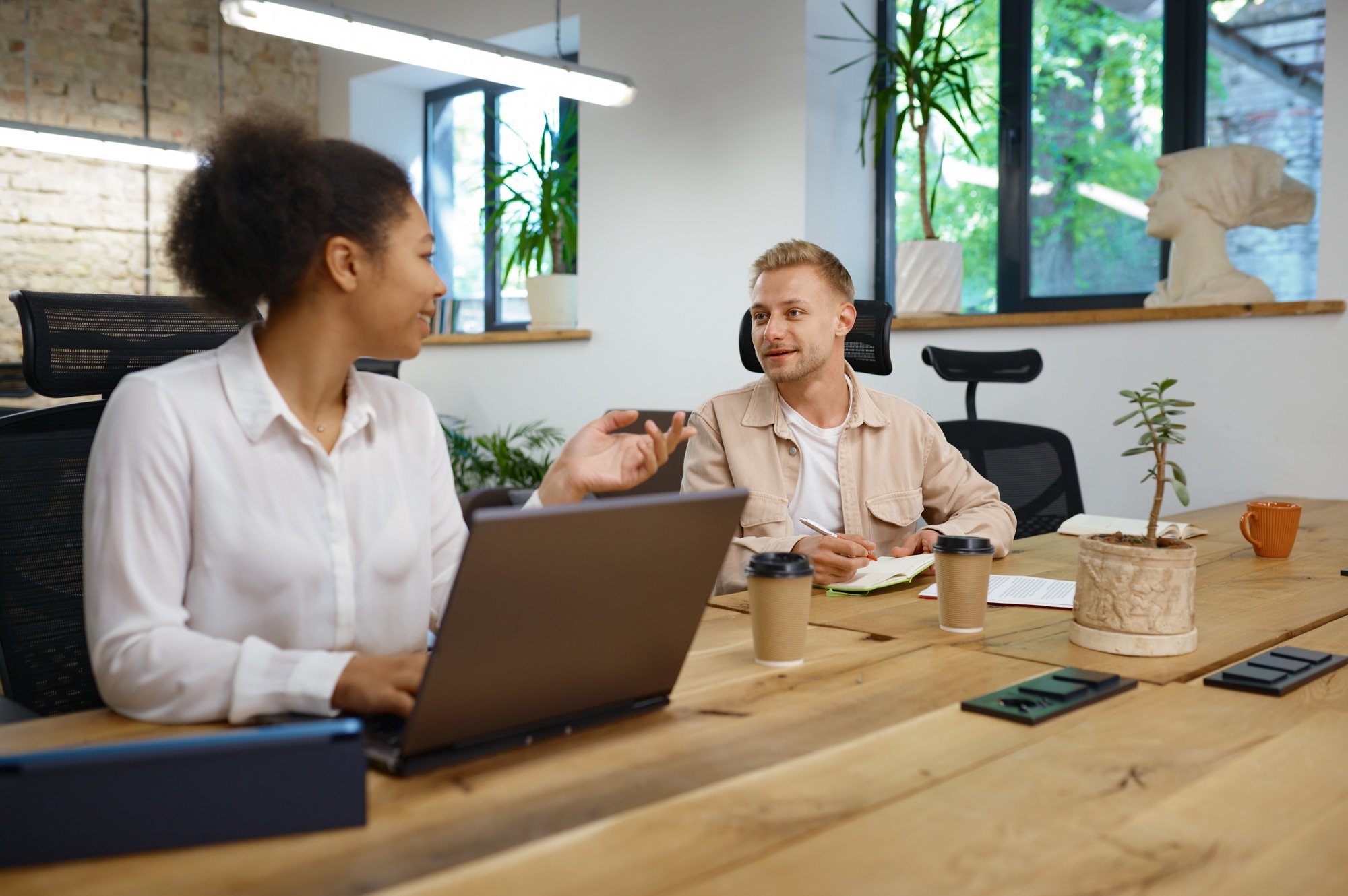 Coworkers talking and planning marketing strategy together