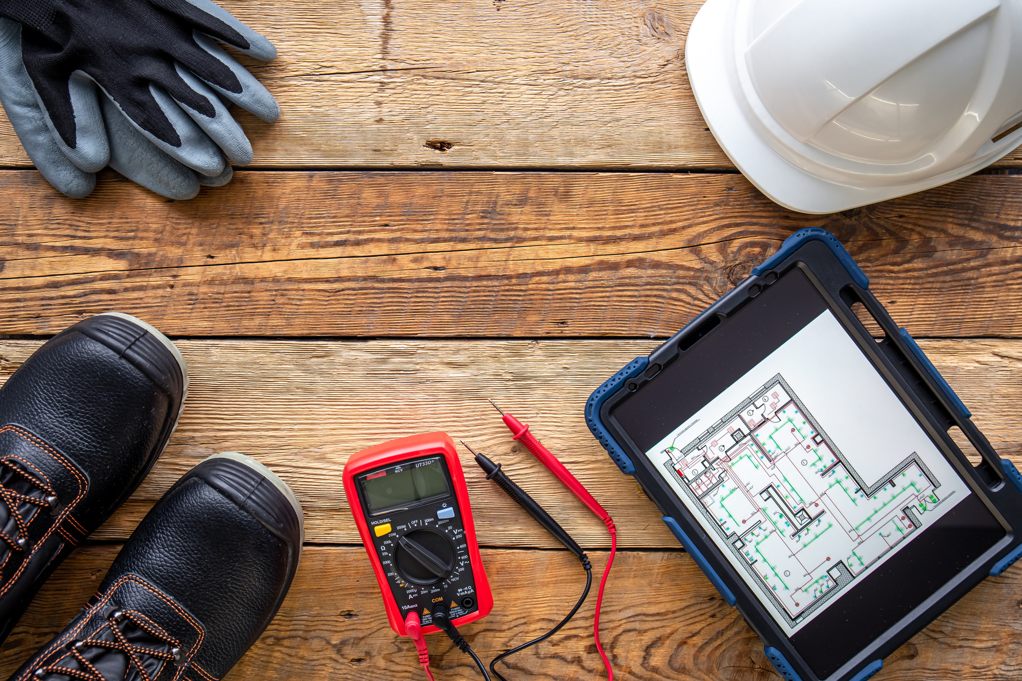 Flat lay composition with electrician's tools and accessories.