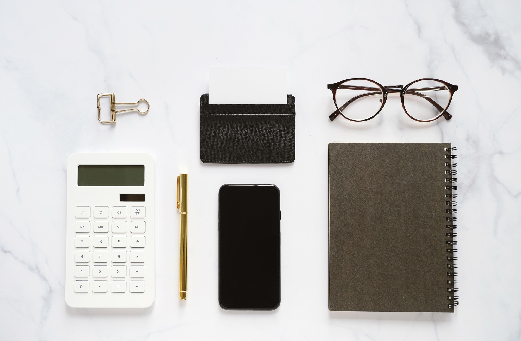 Flat lay of business branding mock up of workspace desk on white marble background