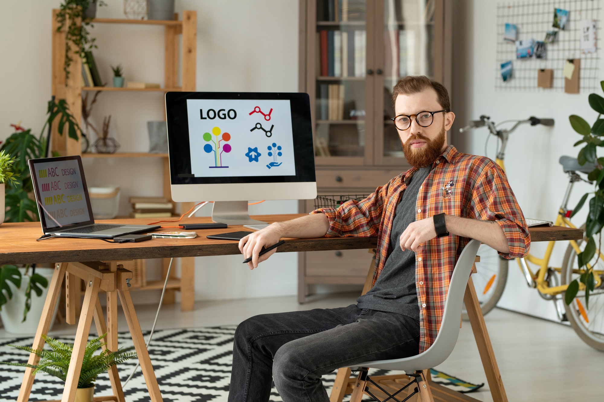 Handsome brand designer at desk