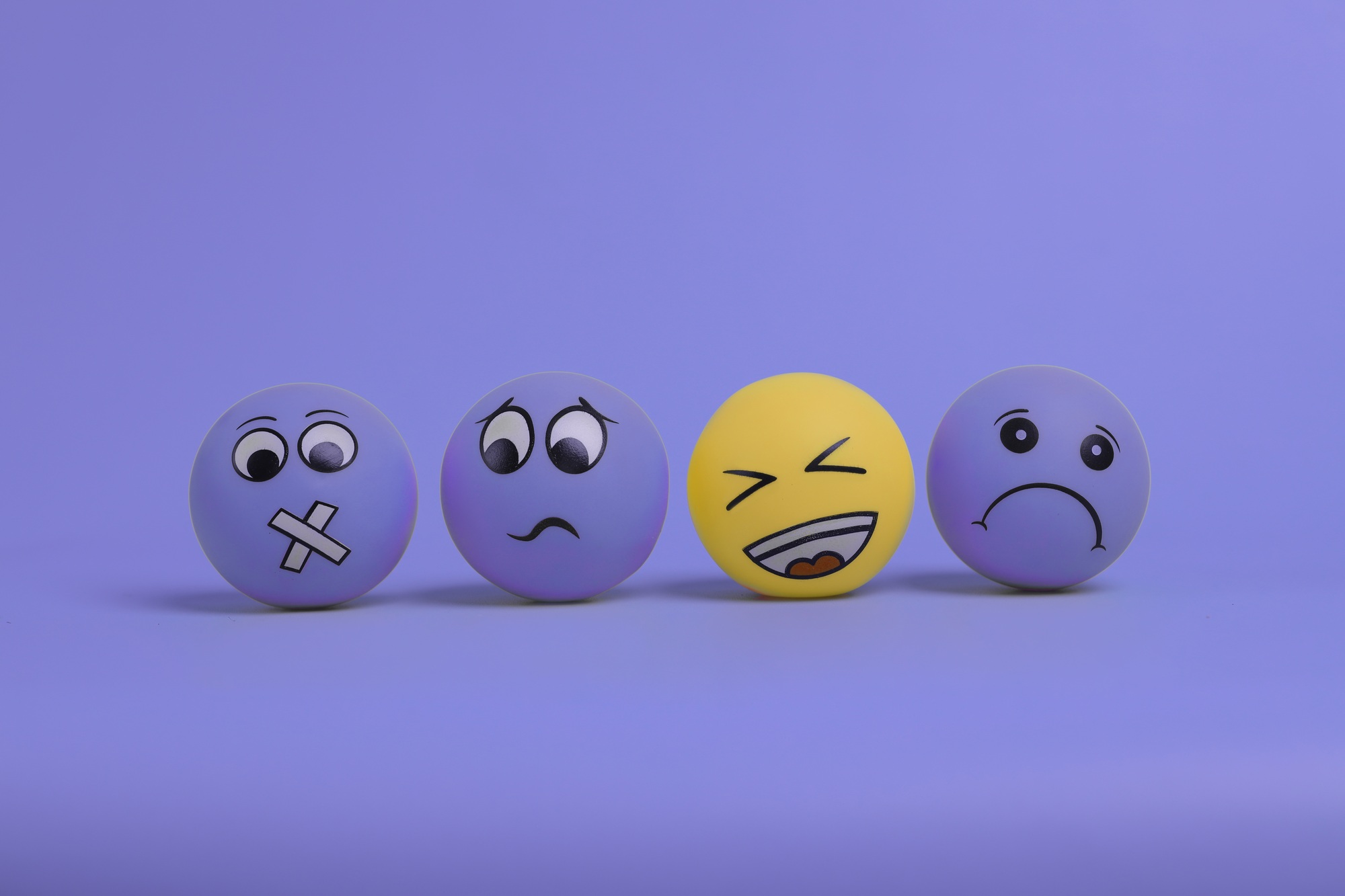 Happy Emoji in purple background