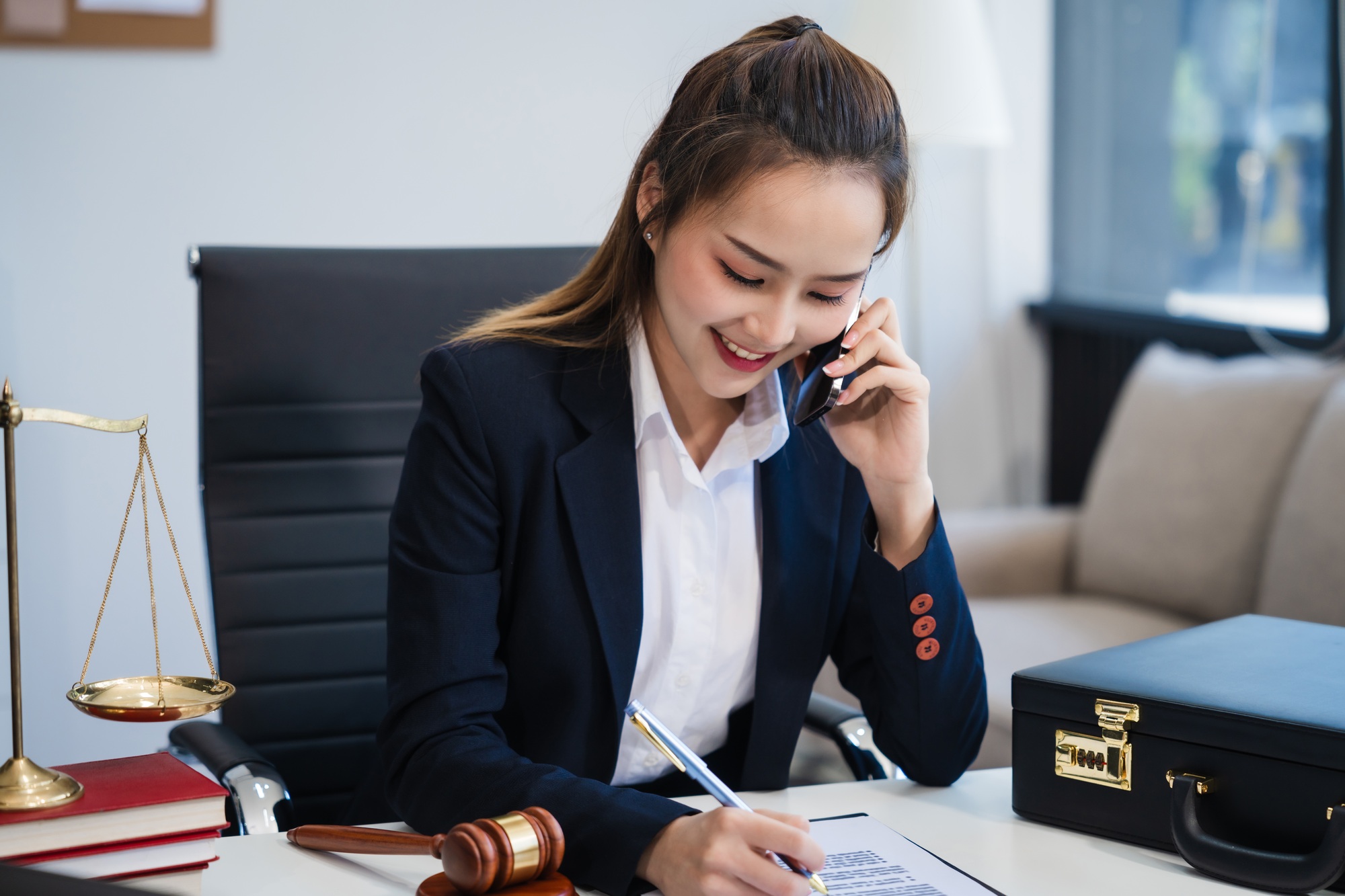 In Asian legal compliance, faculty of law, legal counseling office female lawyer reads a contract