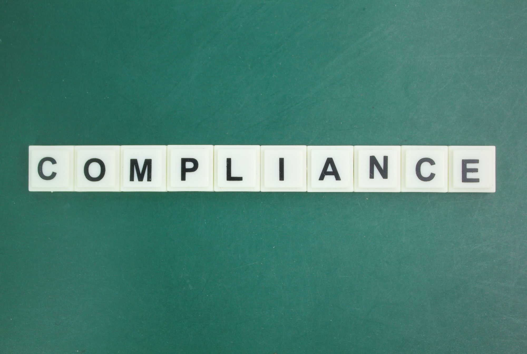 letters of the alphabet with the word compliance. compliance concept.