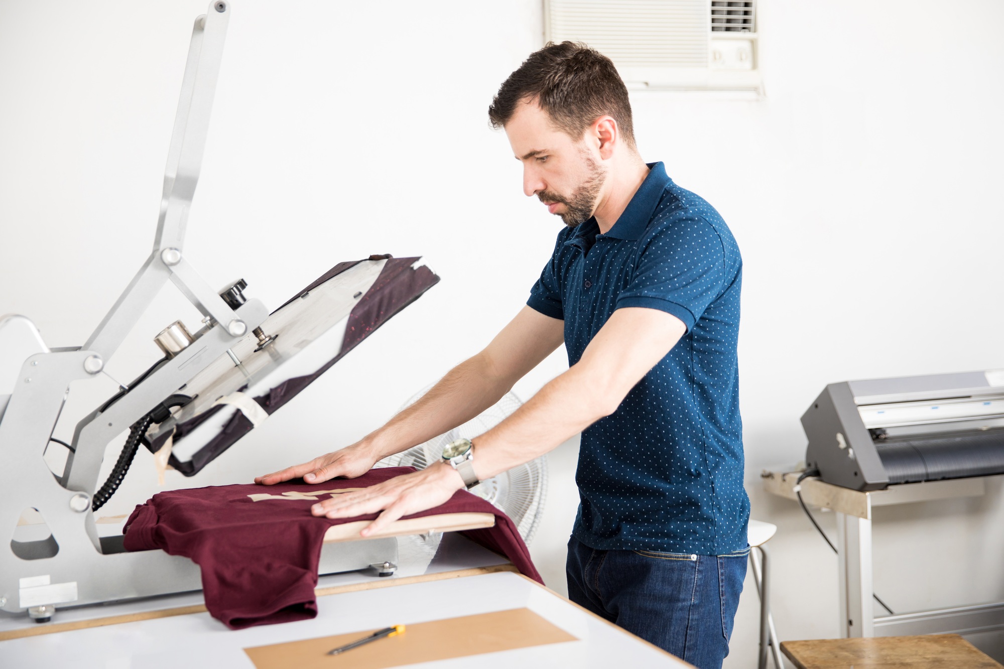 Man using a serigraph press