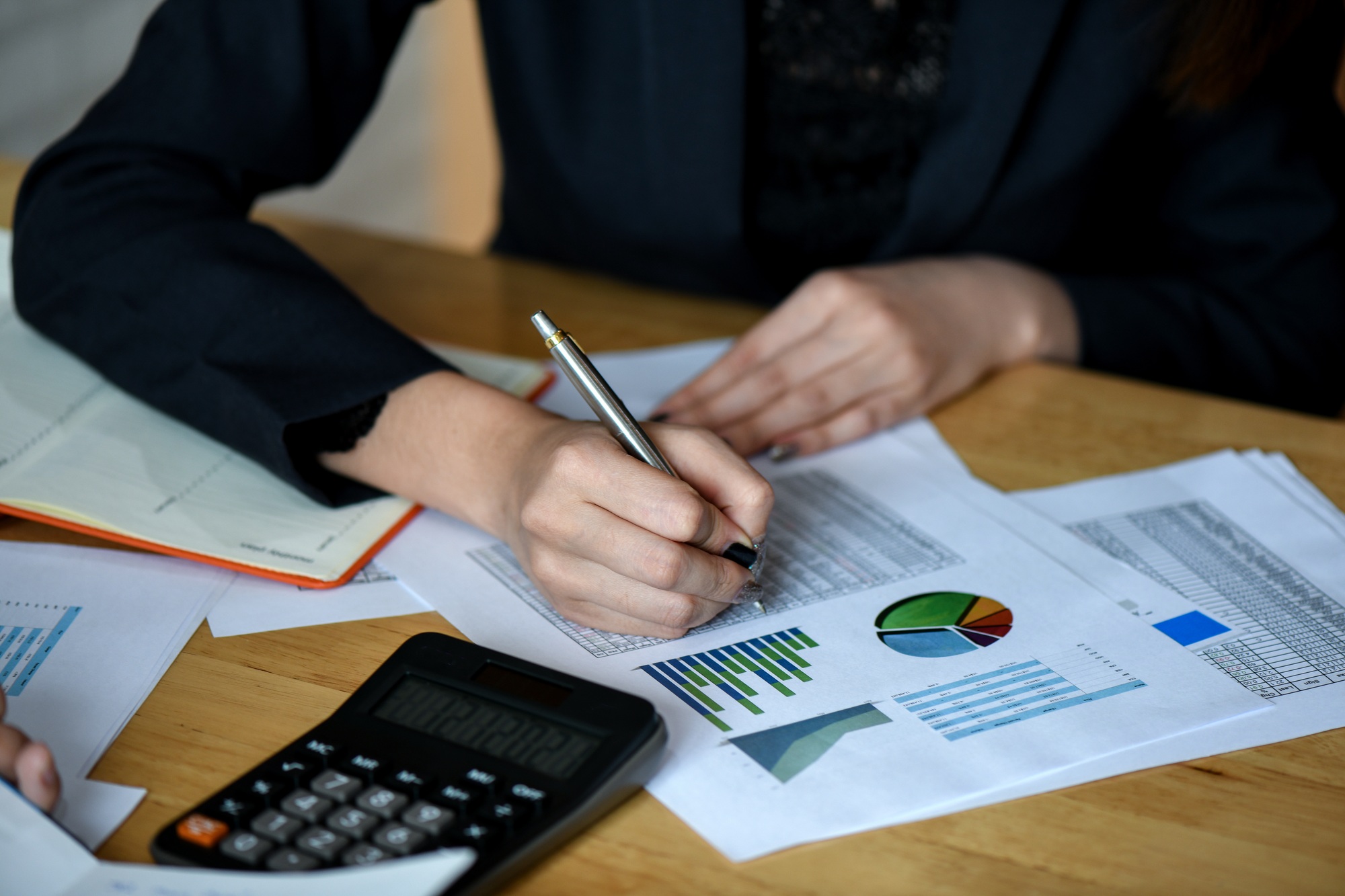 Office staff analyze marketing data on the office desk.