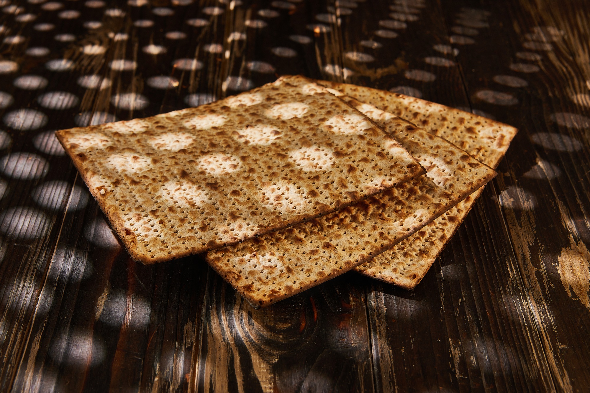 Passover celebration concept - Jewish holiday Passover. Stack of matzo on a wooden background with