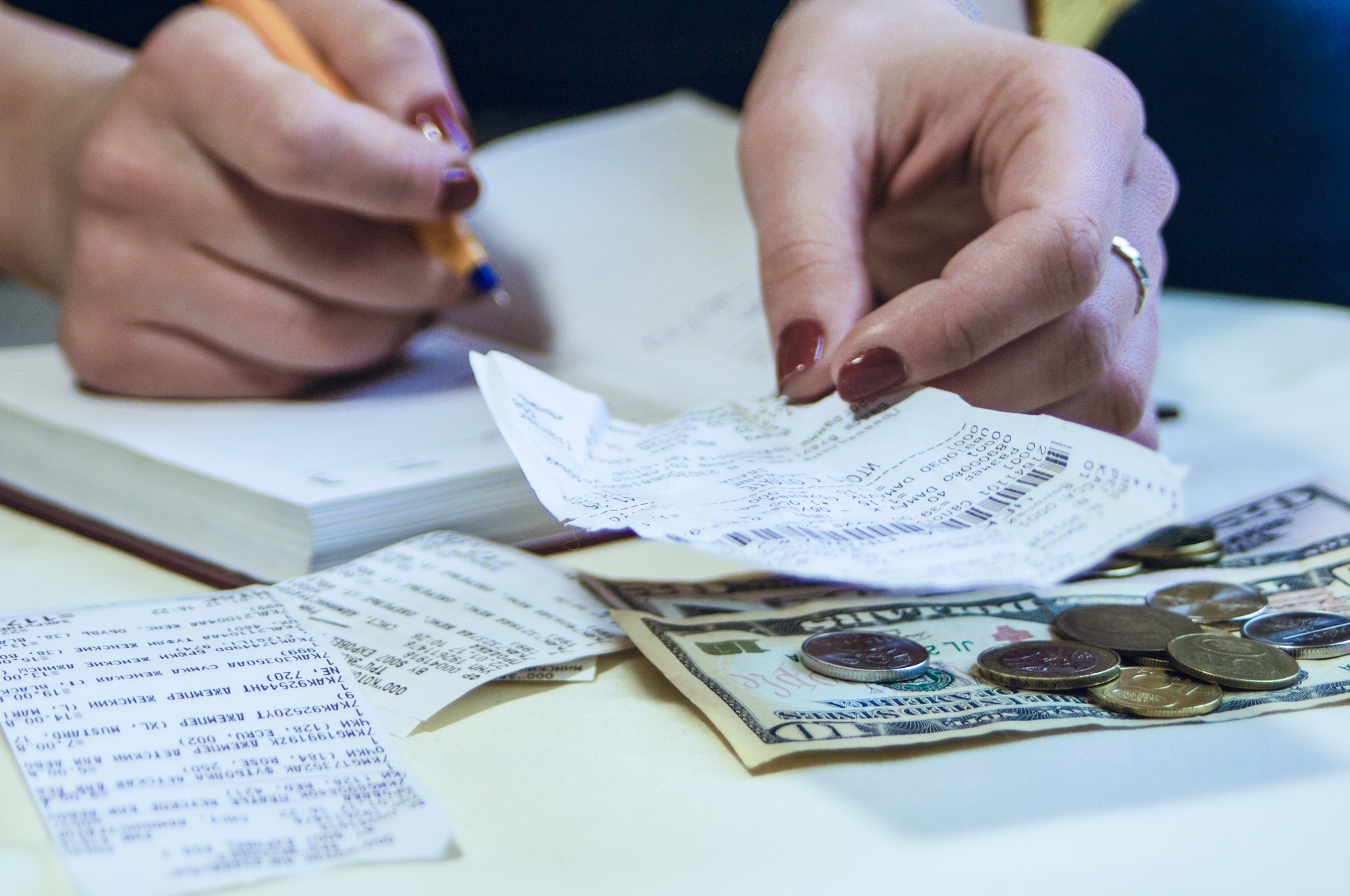 a business woman calculates the financial costs and revenues,