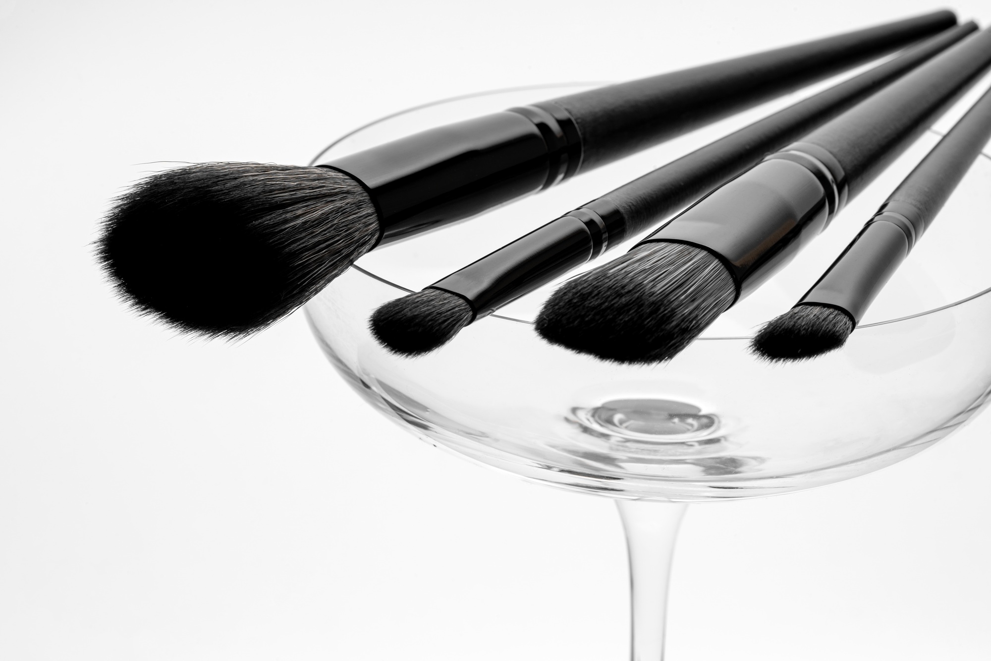 A set of black decorative makeup brushes, marketing presentation, product line