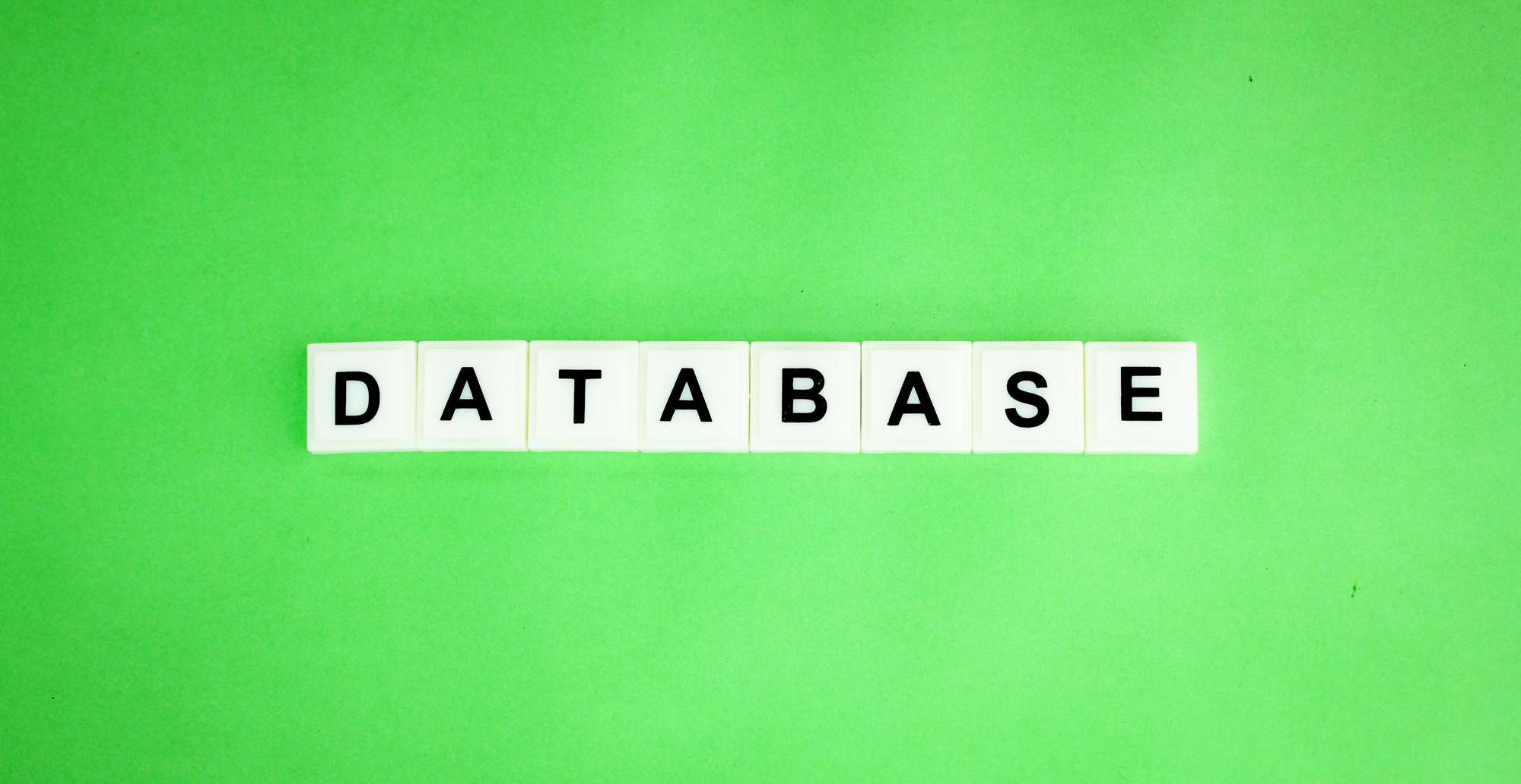 alphabet letters and icons with the word database.