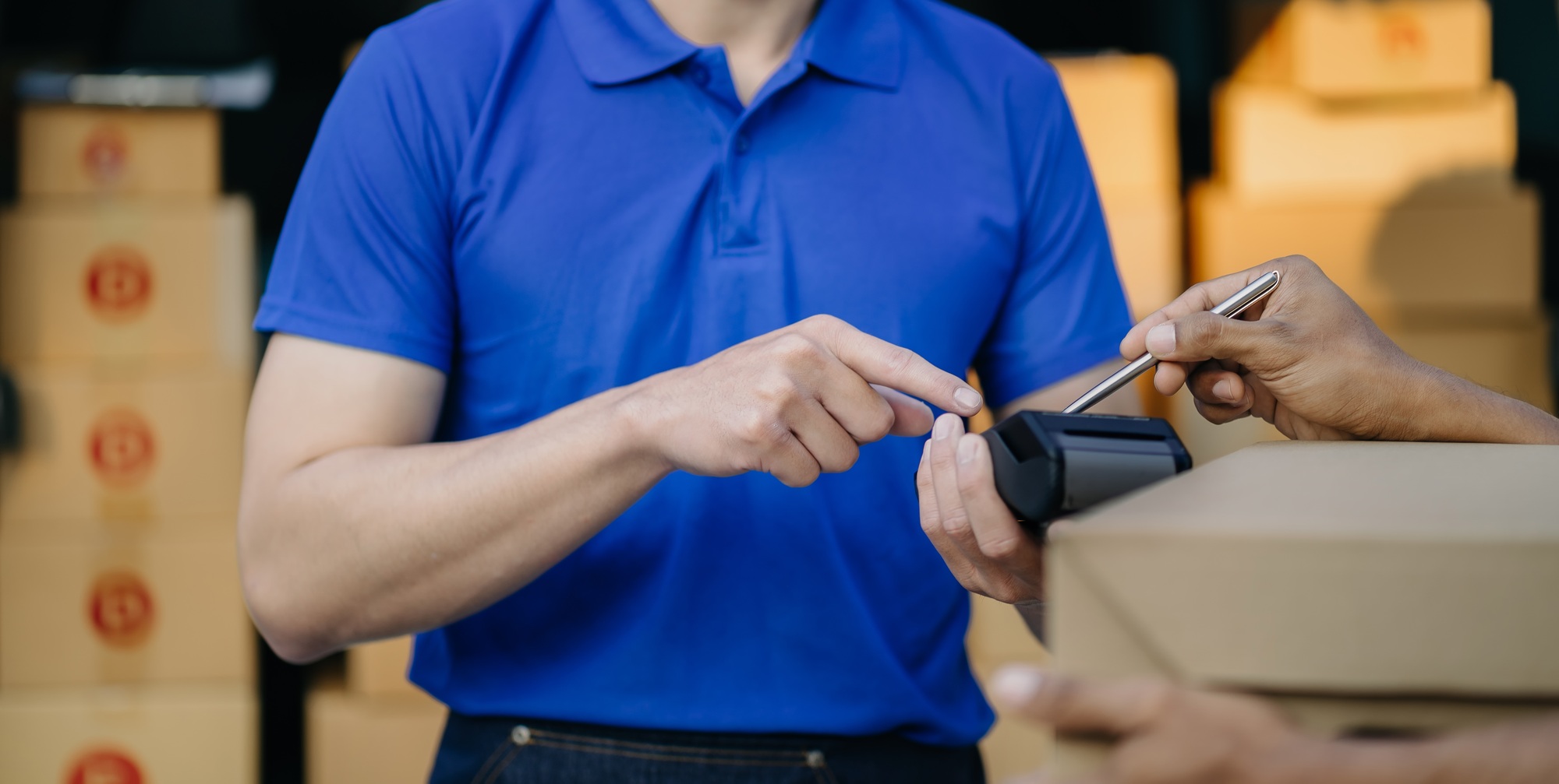 Asian delivery man, Hand using smart phone to scan QR code on tag