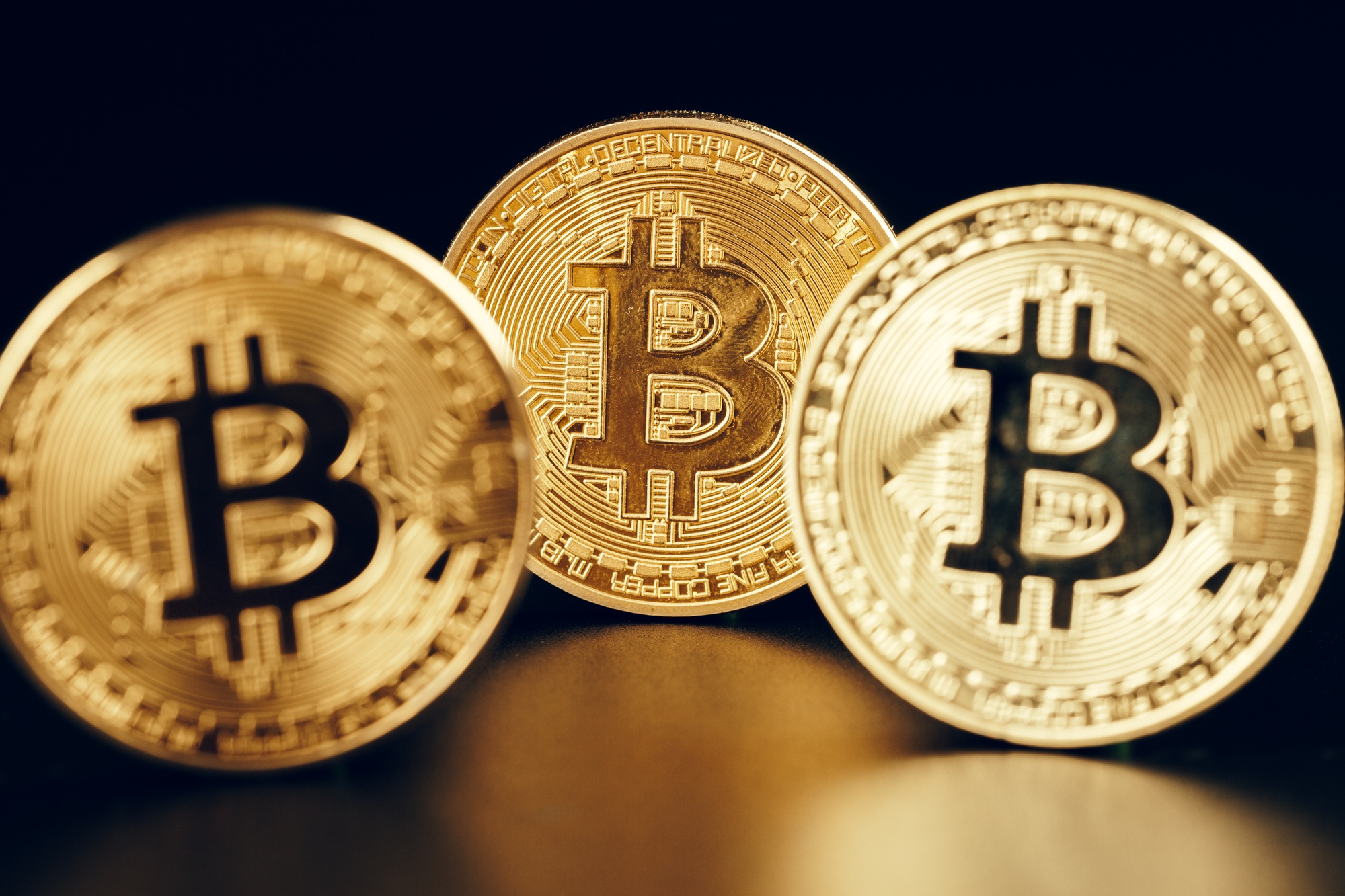 Bitcoins On Black Background. Trading Concept Of Crypto Currency