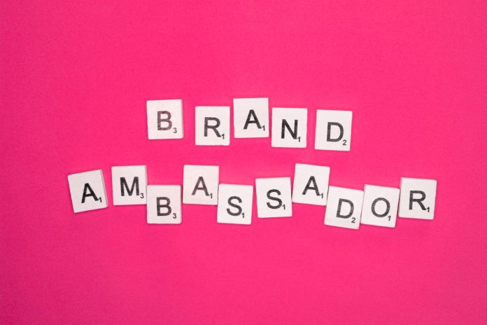 Brand ambassador scrabble letters word on a pink background