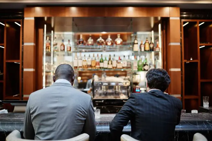 Business People at Bar Counter Back View