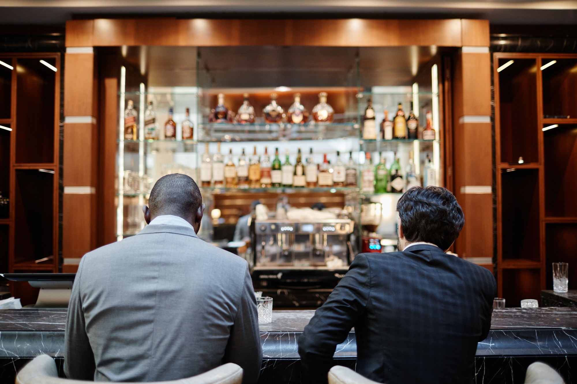 Business People at Bar Counter Back View