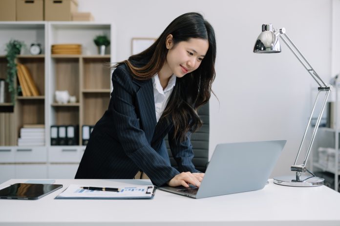 Business people working in the work area with laptop and tablet at the desk. business concepts.