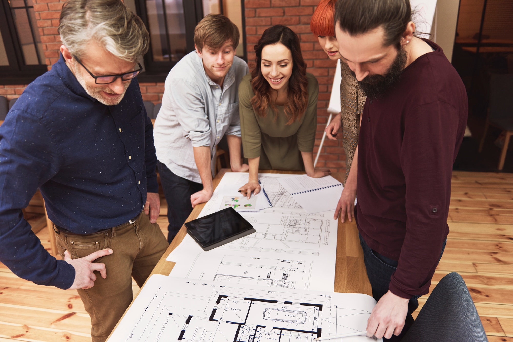 Business team working on the sketch of new house