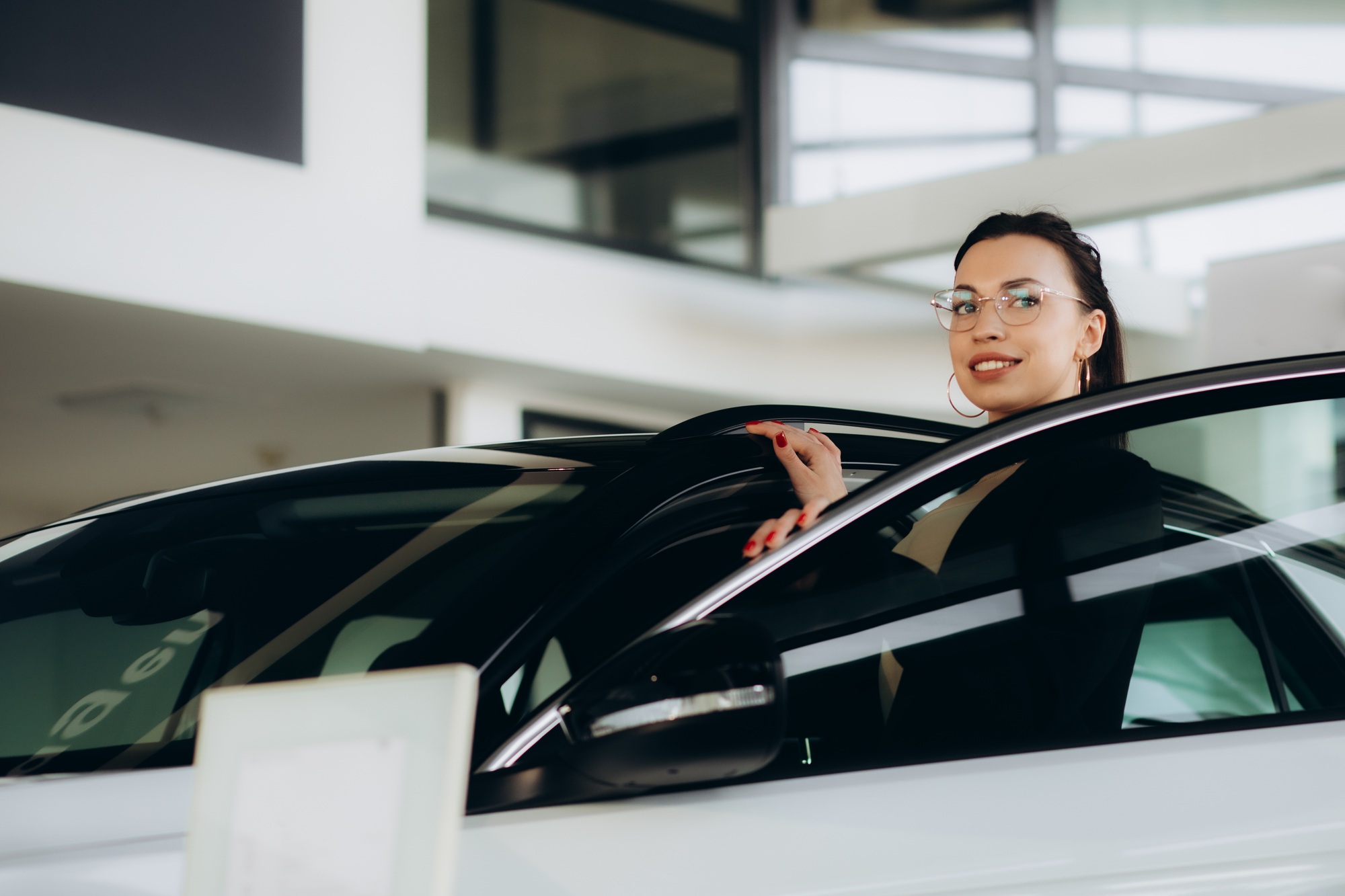 Car dealer woman. Auto dealership and rental concept background.