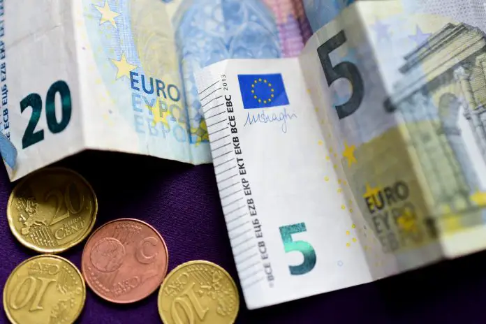 Cash euro money on purple background