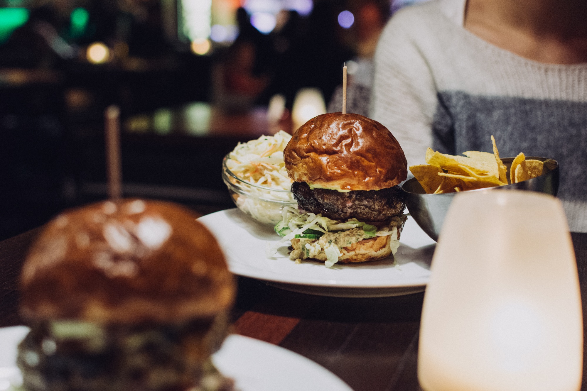 Celebrating with a juicy beef burger in a restaurant