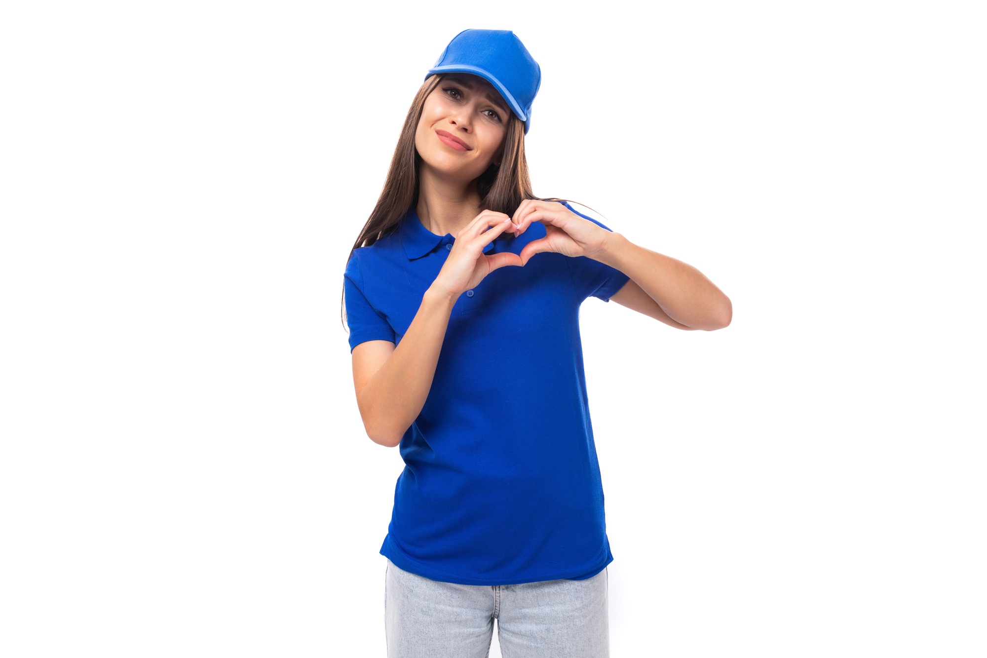 charming young caucasian brunette woman in uniform t-shirt and cap with space for brand print