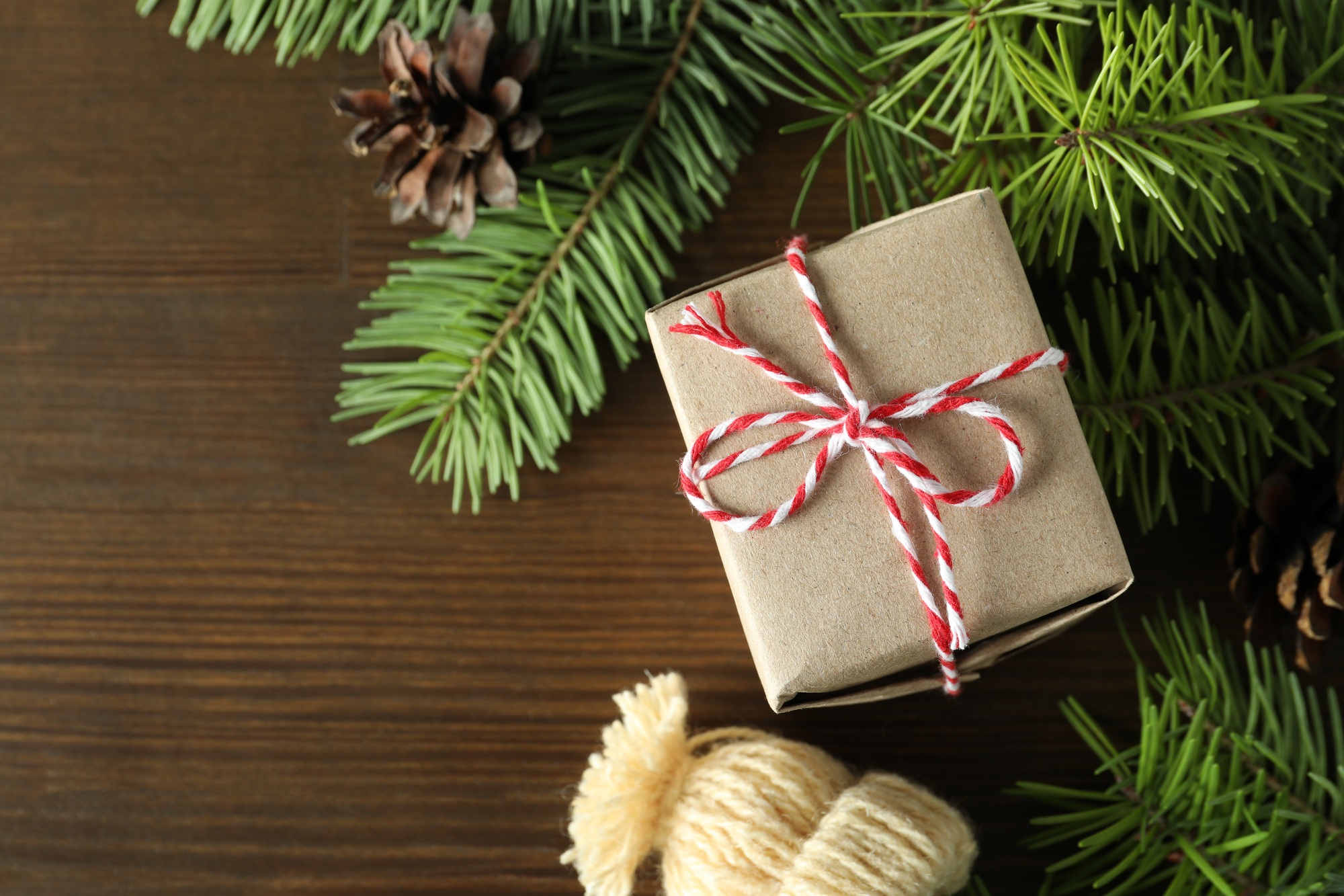 Christmas concept with gift on wooden background