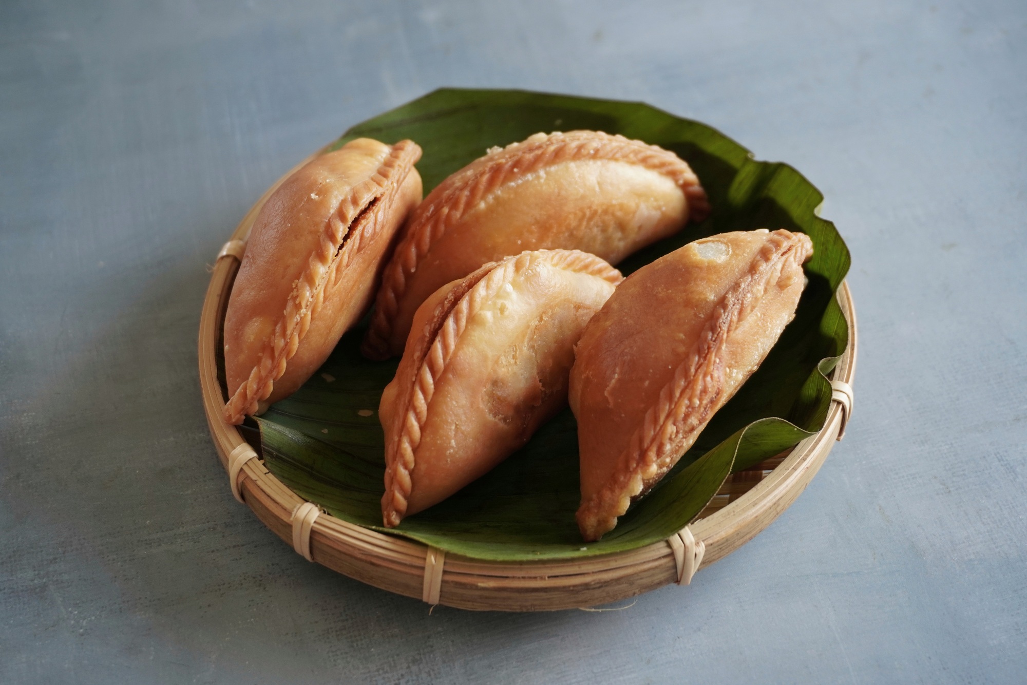 Close up image of Malaysian traditional snack karipap.