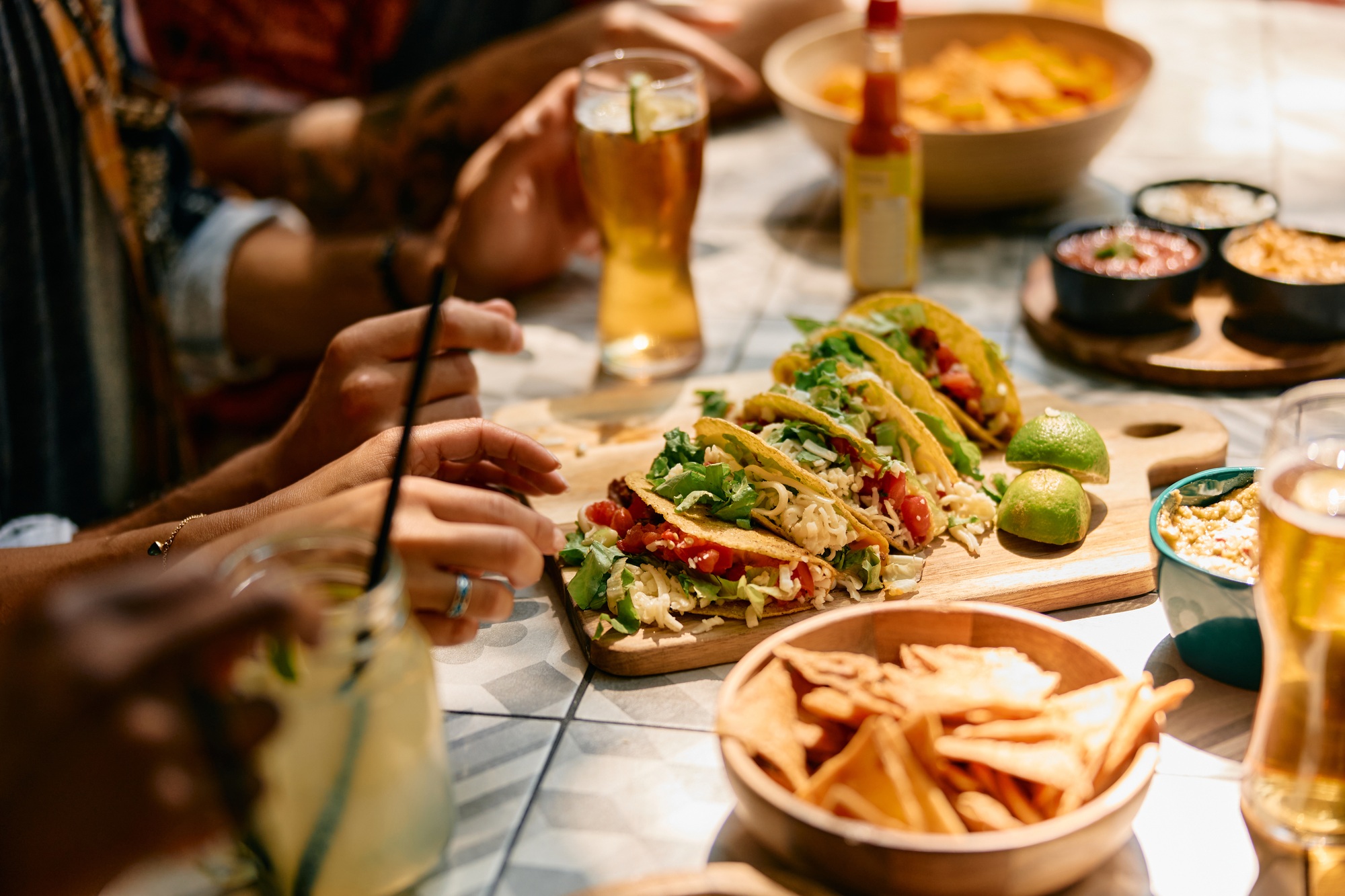 Close up of people eating in Mexican restaurant.