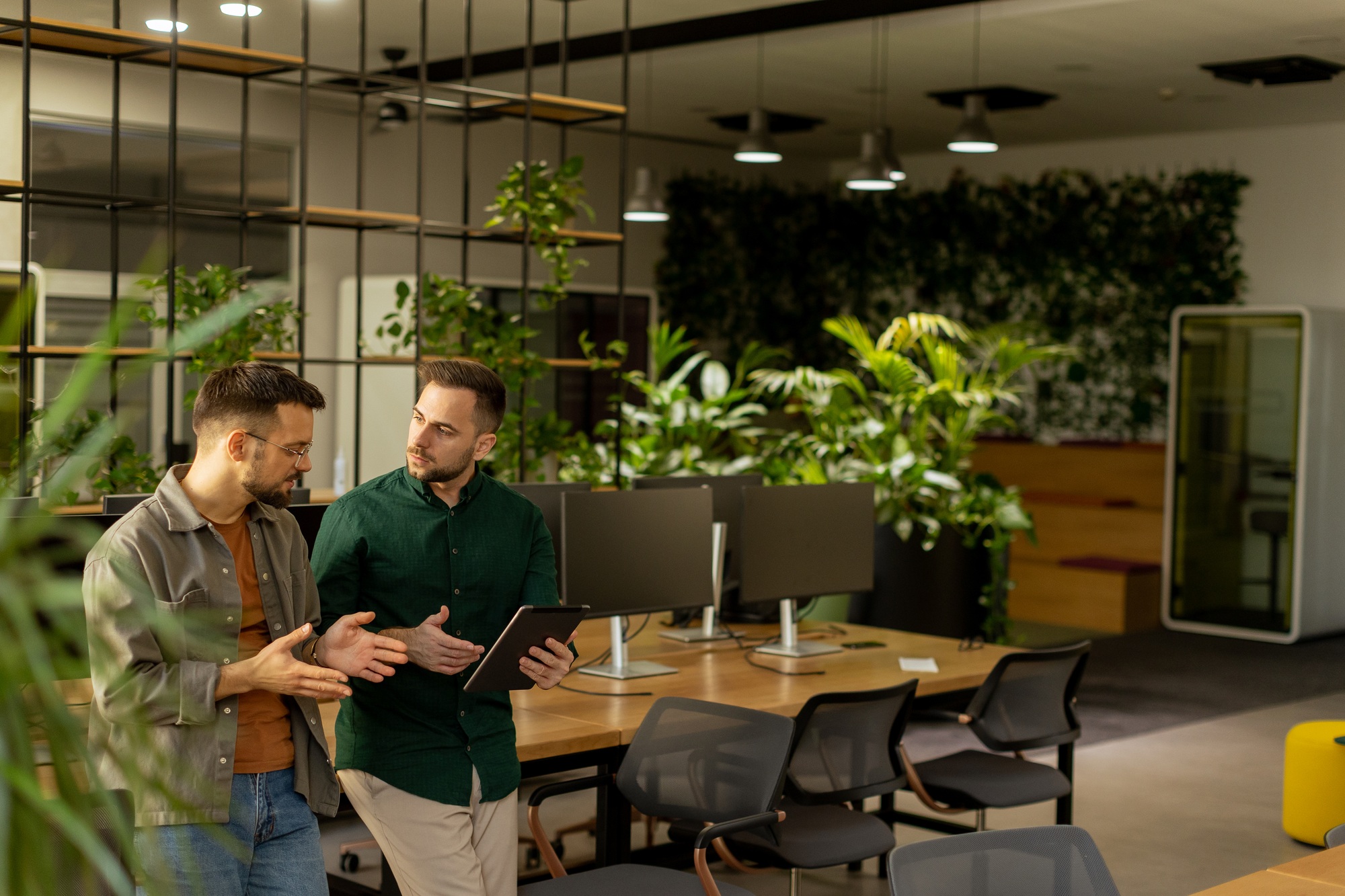 Collaborative Discussion in a Modern Office With Exposed Brick Walls
