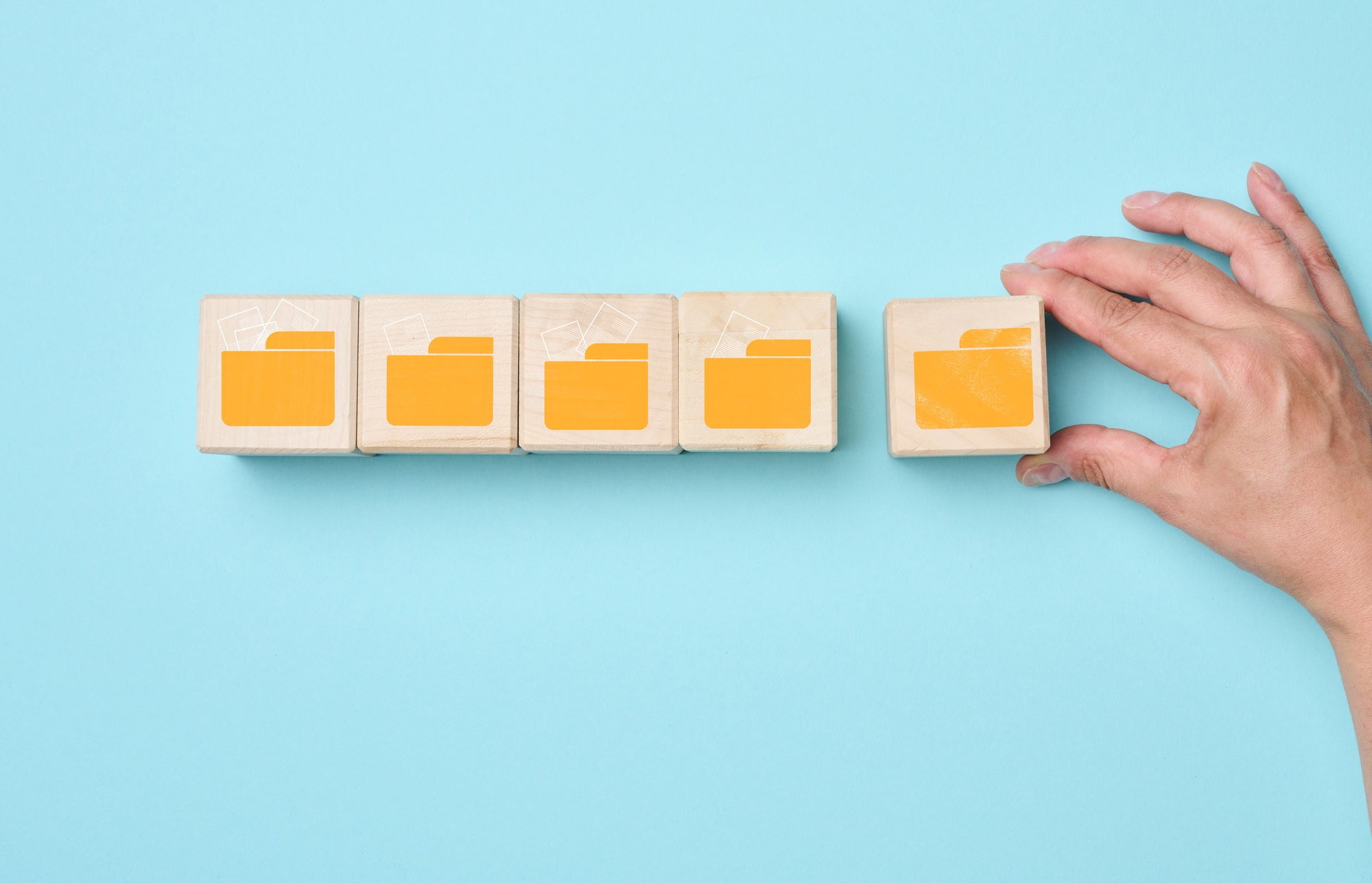 Cubes with folder icons on a blue background. Data systematization concept
