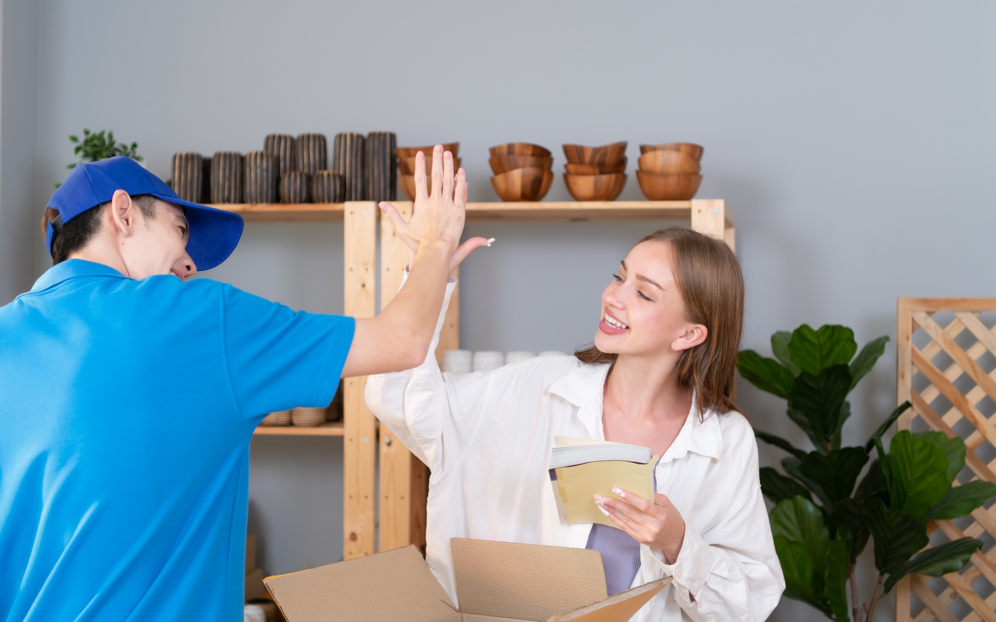 Delivery man assists the customer to record images to check the product  after delivery