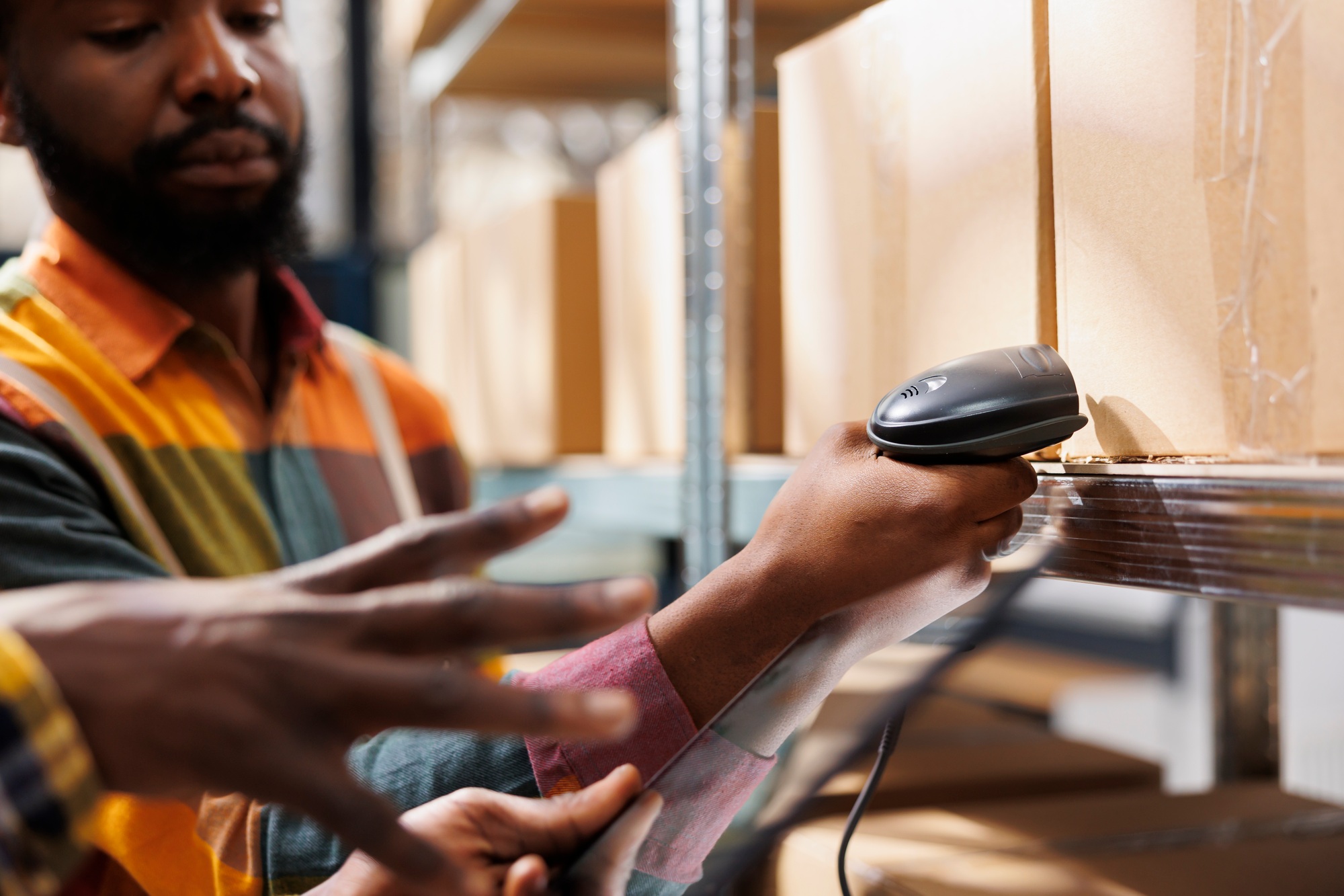 Delivery service employees checking box qr code in warehouse