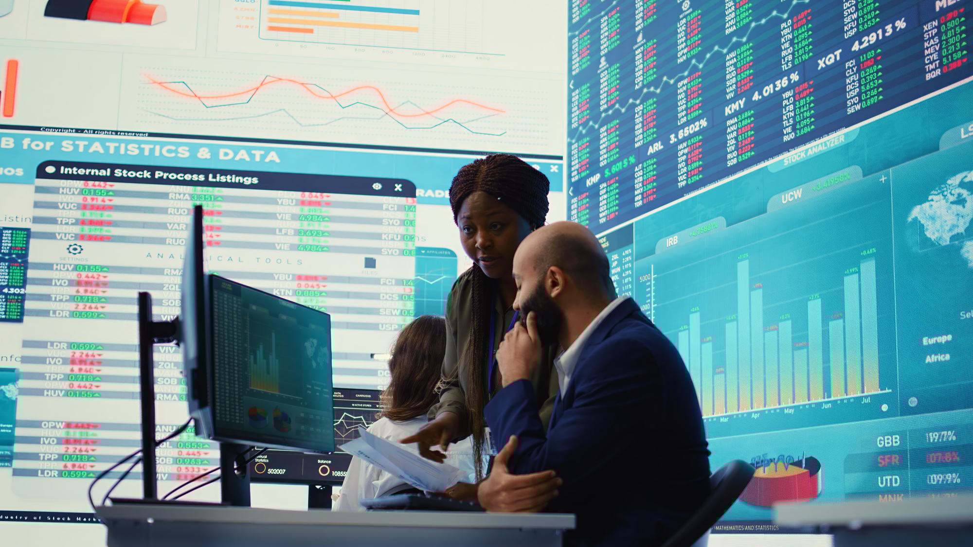 Diverse business analysts working to evaluate costs and create a projection