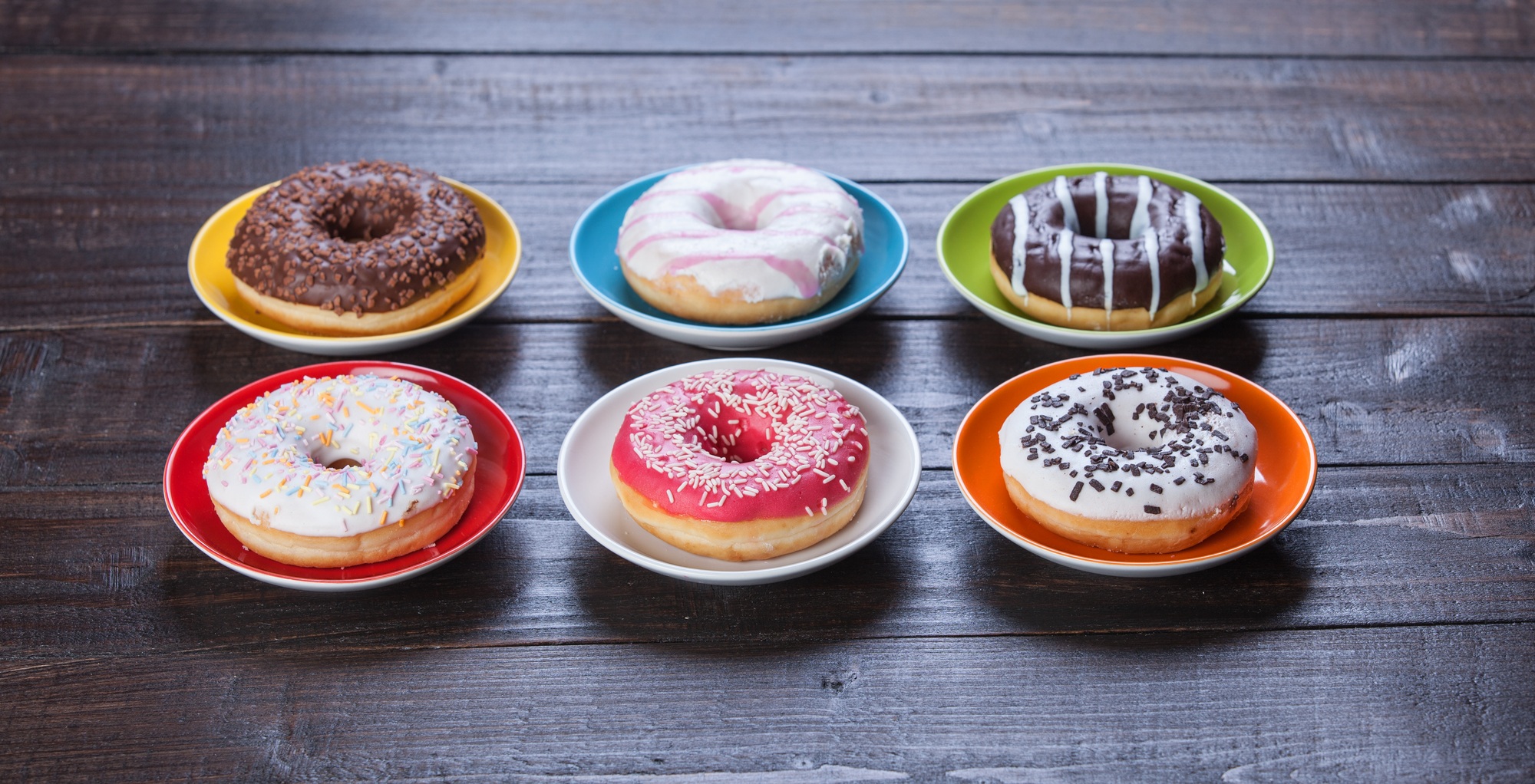 Donuts on wooden table.