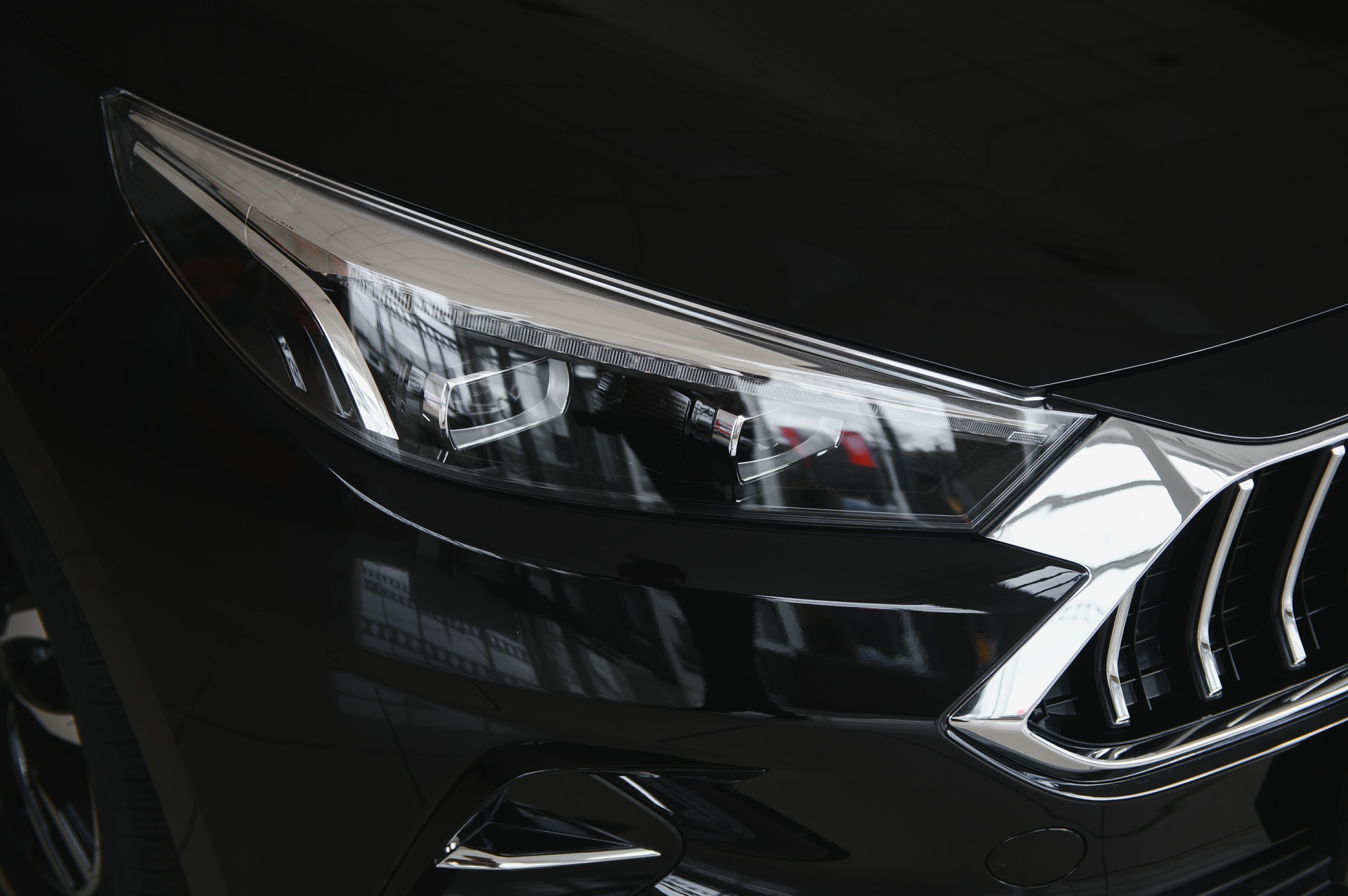 elements of the design of a modern car in a car showroom