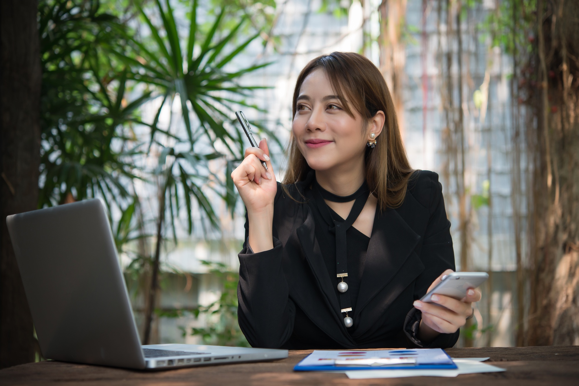 Executive thinking over working schedule for employee writing report into notebook.