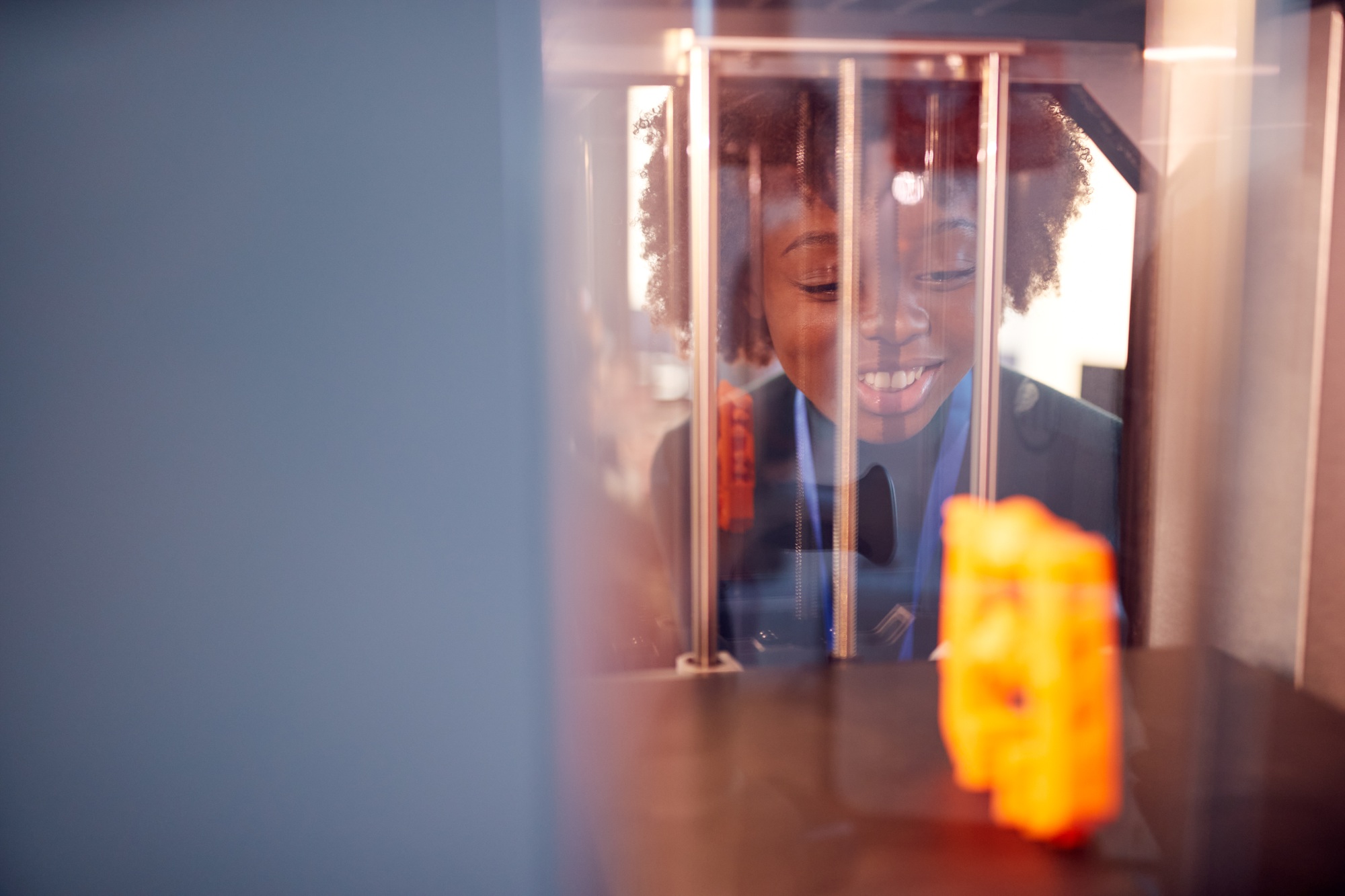 Female College Student Studying Engineering Using 3D Printing Machine